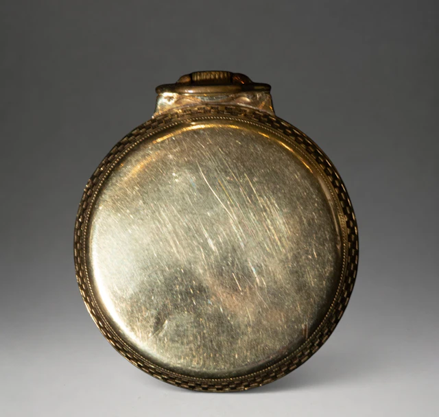 Pocket watch with decorated metal case