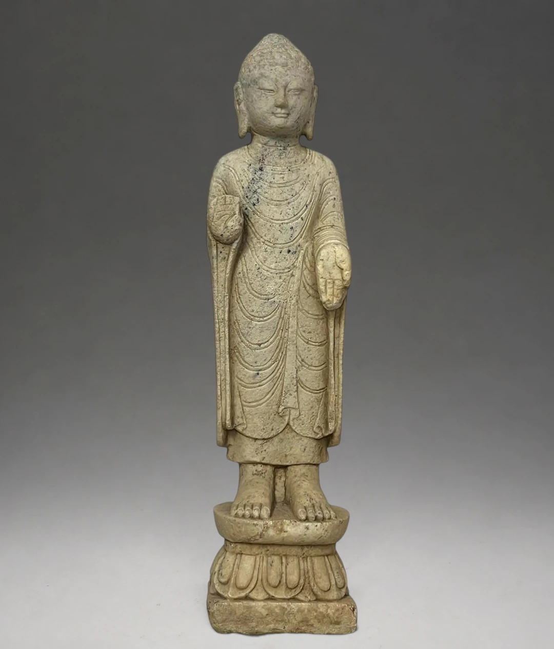 Highly decorative Buddha standing on a lotus-shaped base, China, Northern
