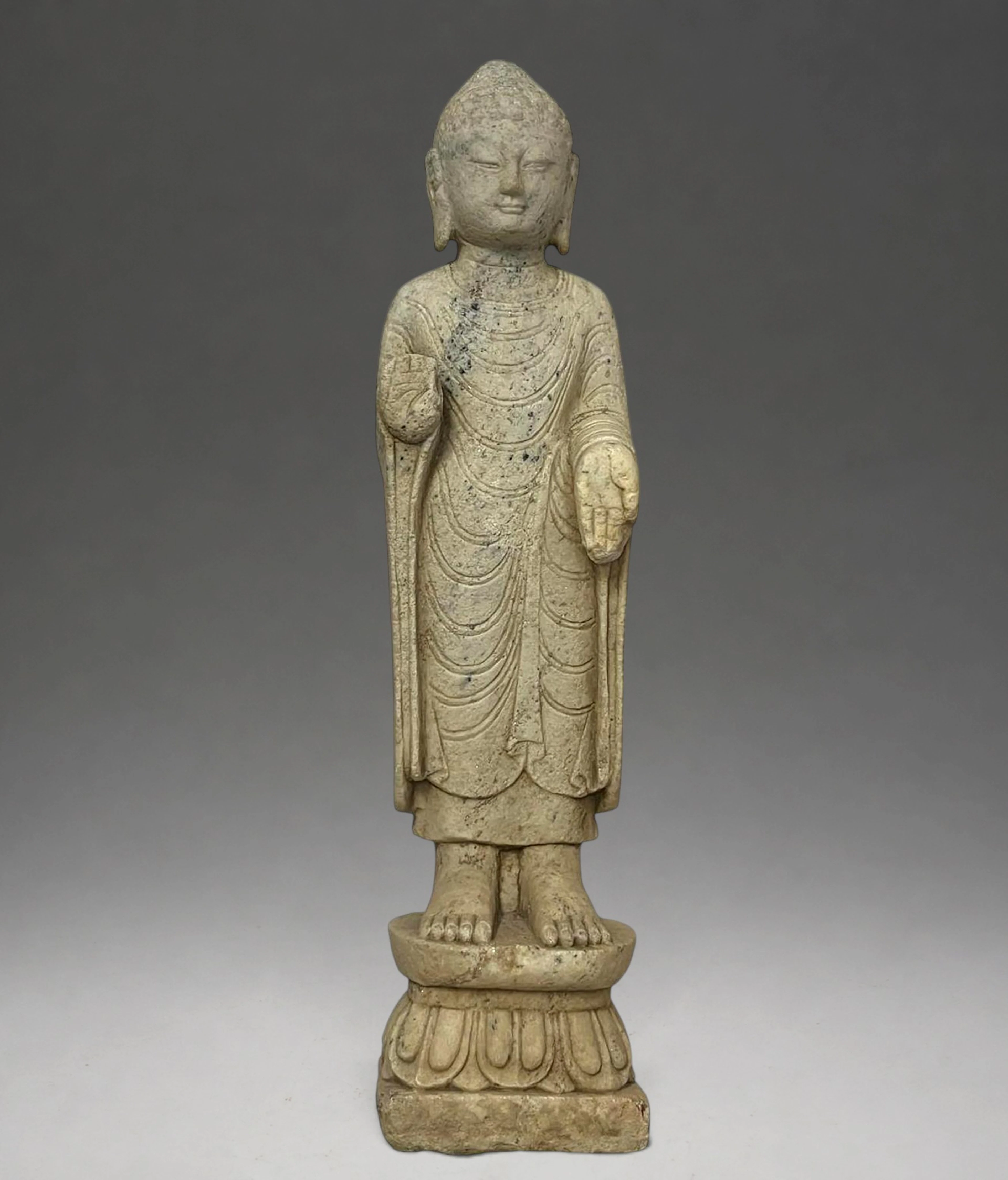 Highly decorative Buddha standing on a lotus-shaped base, China, Northern