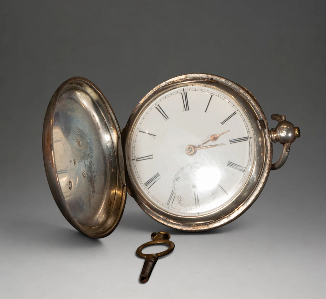 Pocket watch with decorated cover and Roman numerals