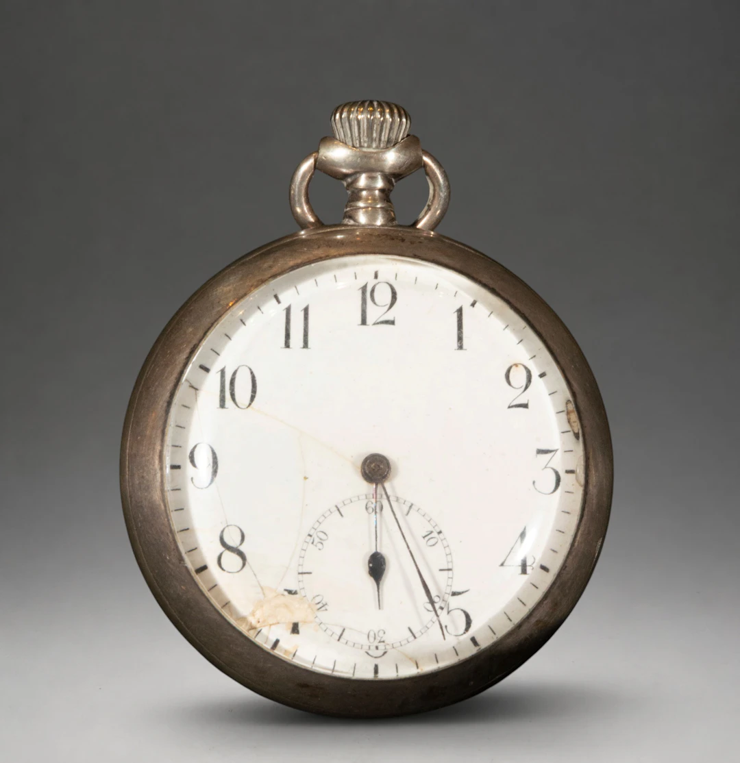 Pocket watch with white dial and Roman numerals