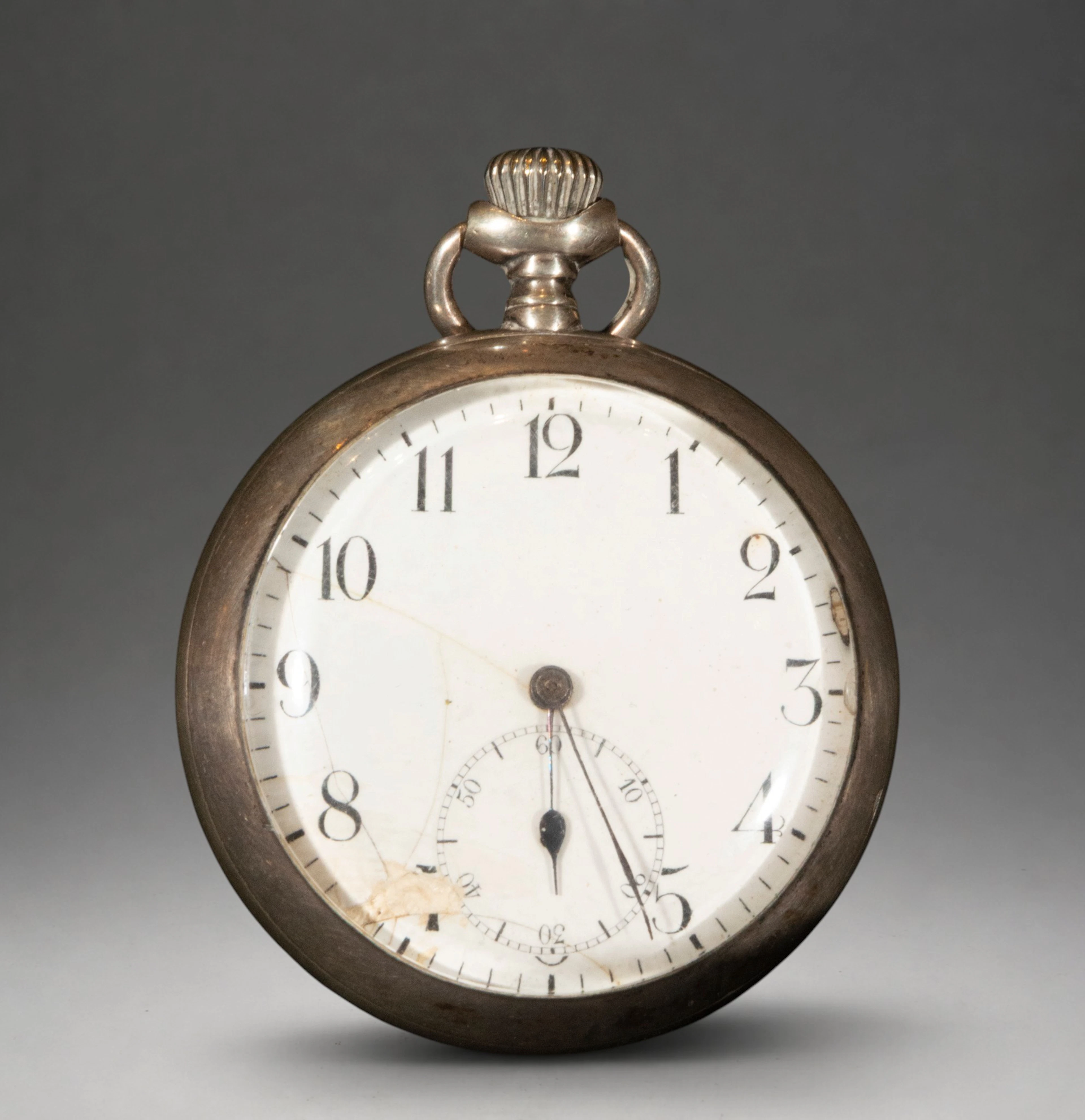Pocket watch with white dial and Roman numerals