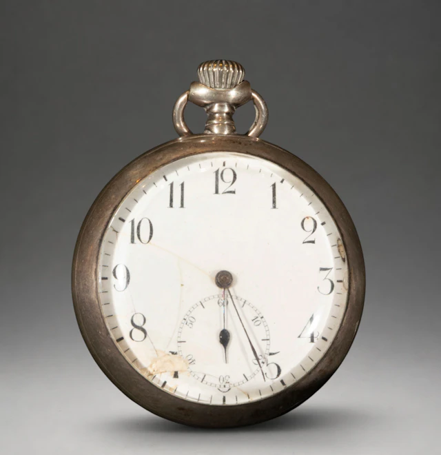 Pocket watch with white dial and Roman numerals
