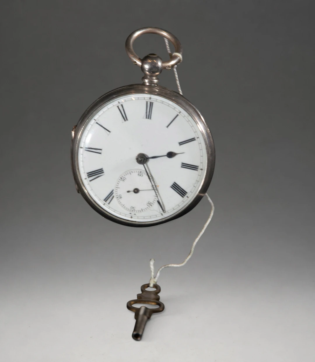 Pocket watch with winding key