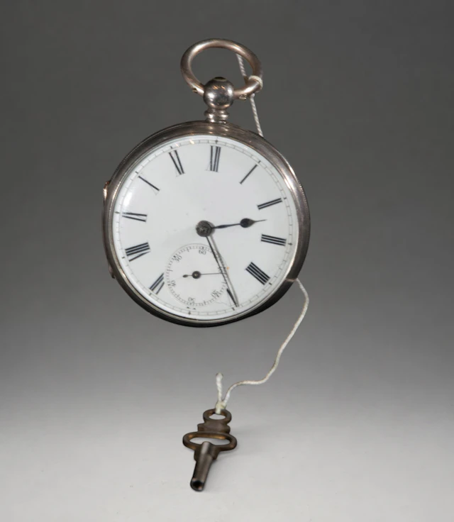Pocket watch with winding key
