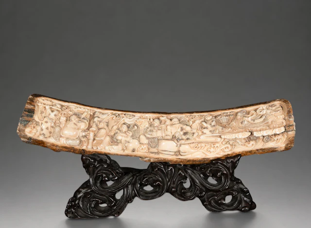 Mammoth tusk carved with auspicious figures and motifs, signed – China