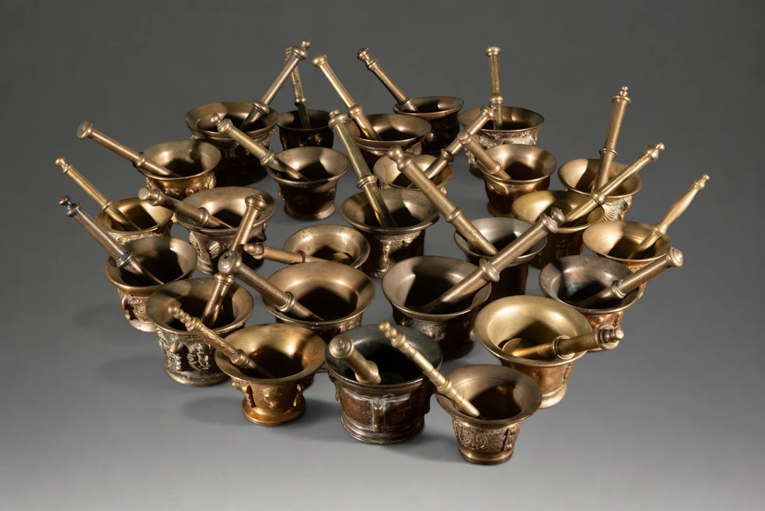 Collection of twenty-four bronze mortars with their handles
