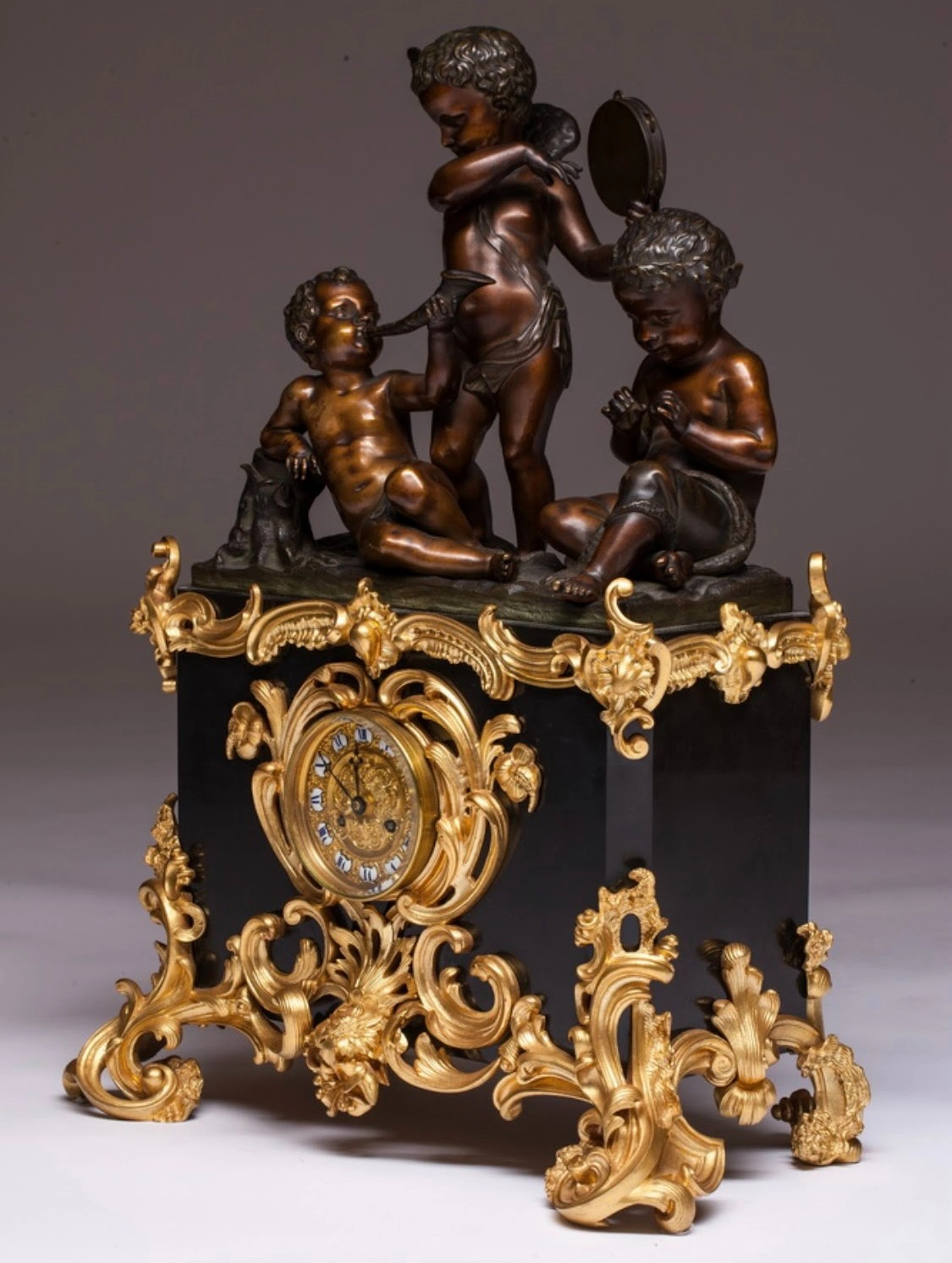Louis XVI style Denière Paris table clock in gilt and patinated bronze