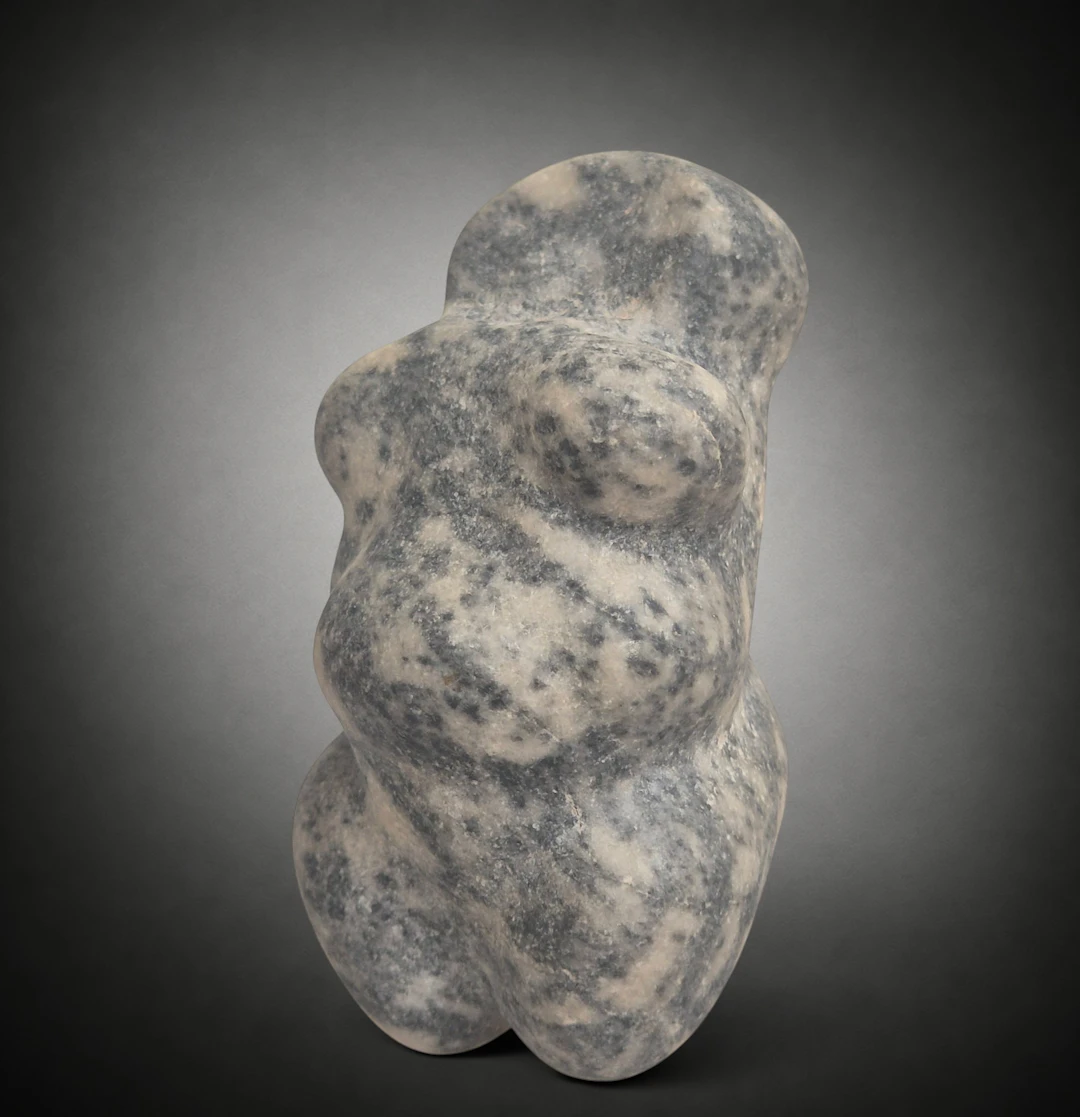 Neolithic steatopygous female figure in grey-black marble, Mediterranean