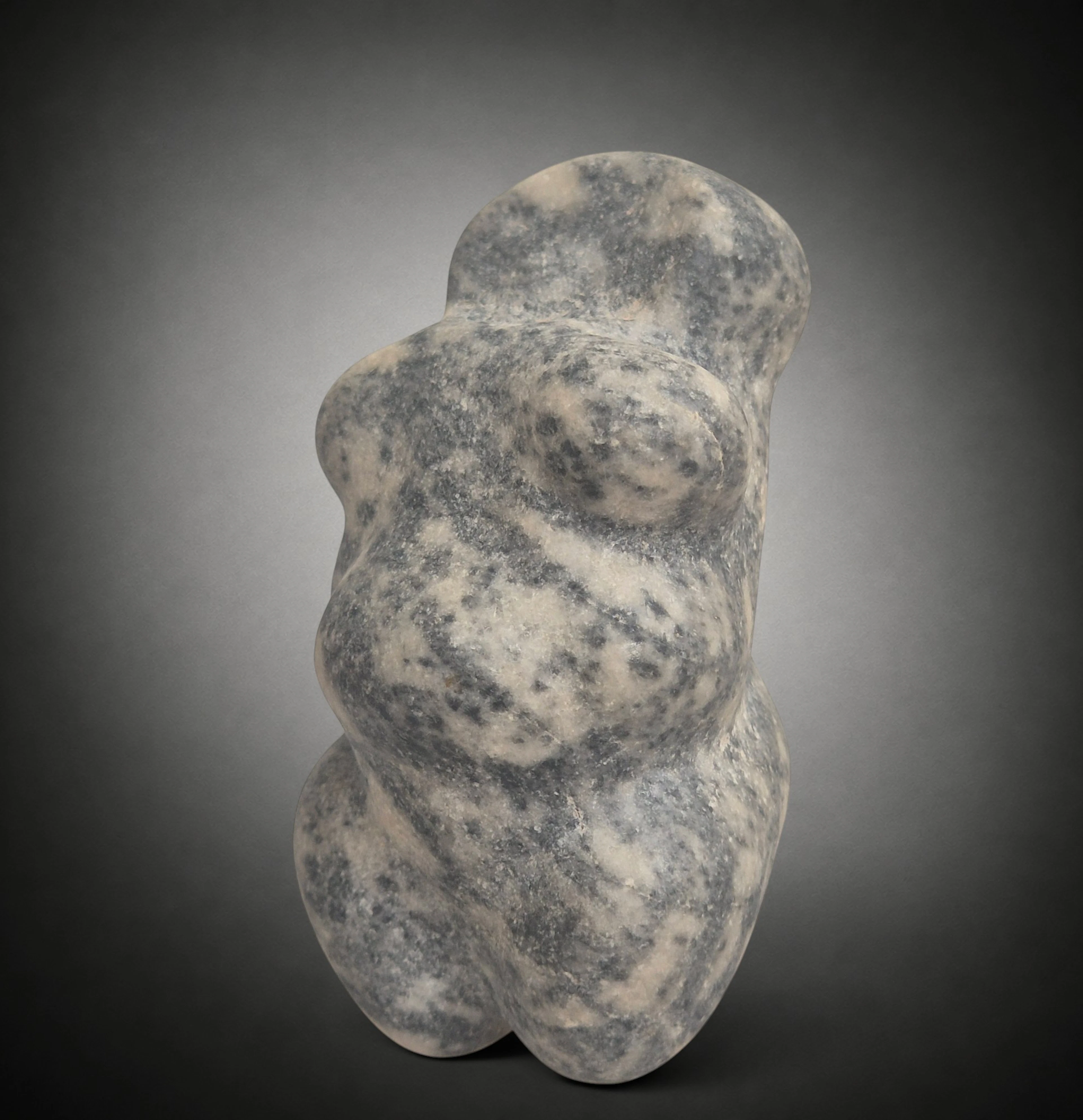 Neolithic steatopygous female figure in grey-black marble, Mediterranean