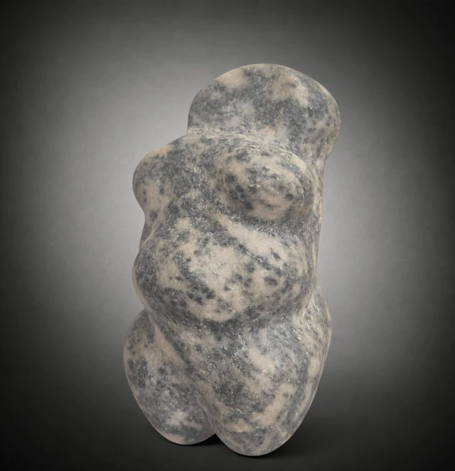 Neolithic steatopygous female figure in grey-black marble, Mediterranean