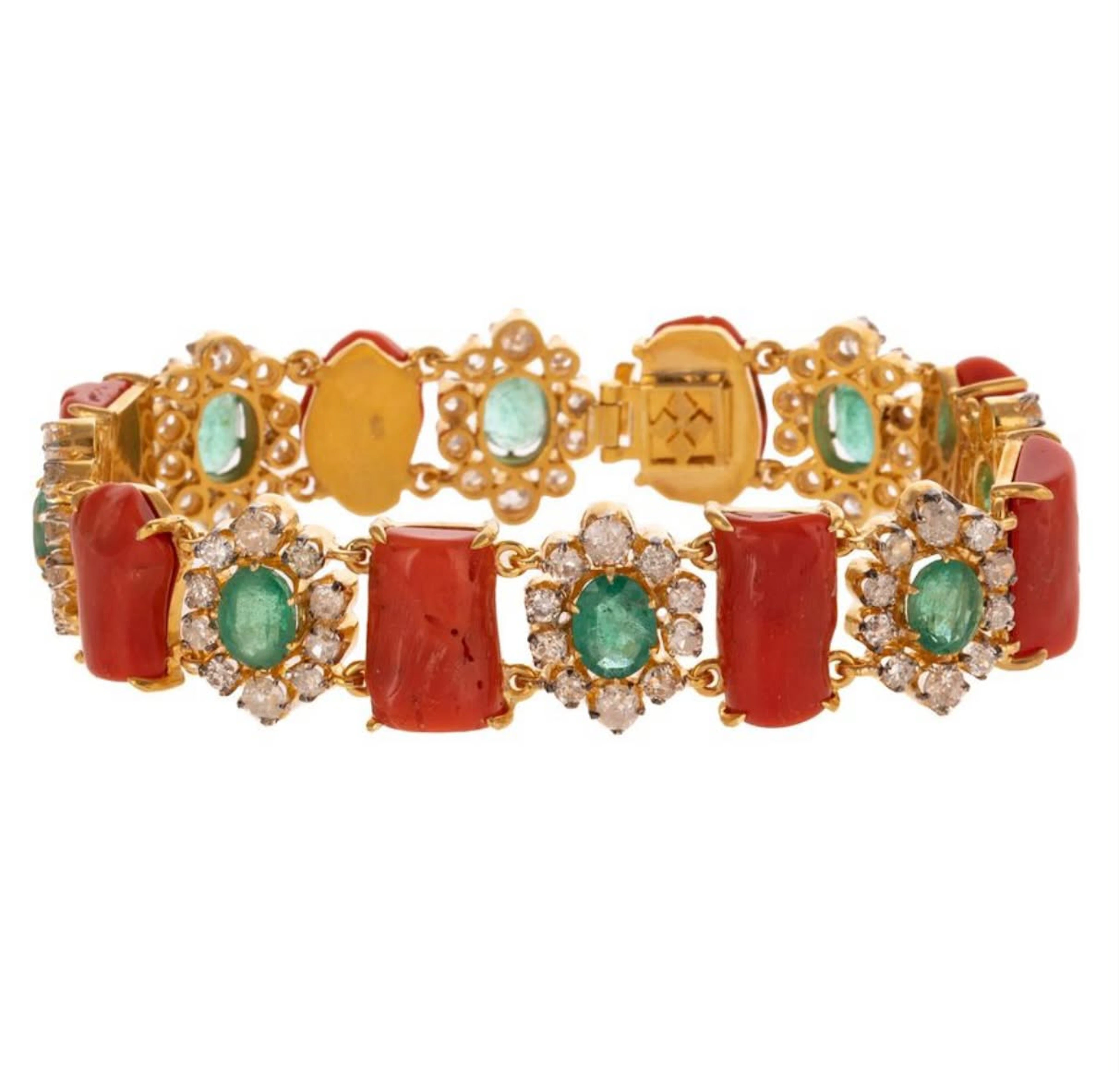 Bracelet made of natural coral, emeralds and diamonds.