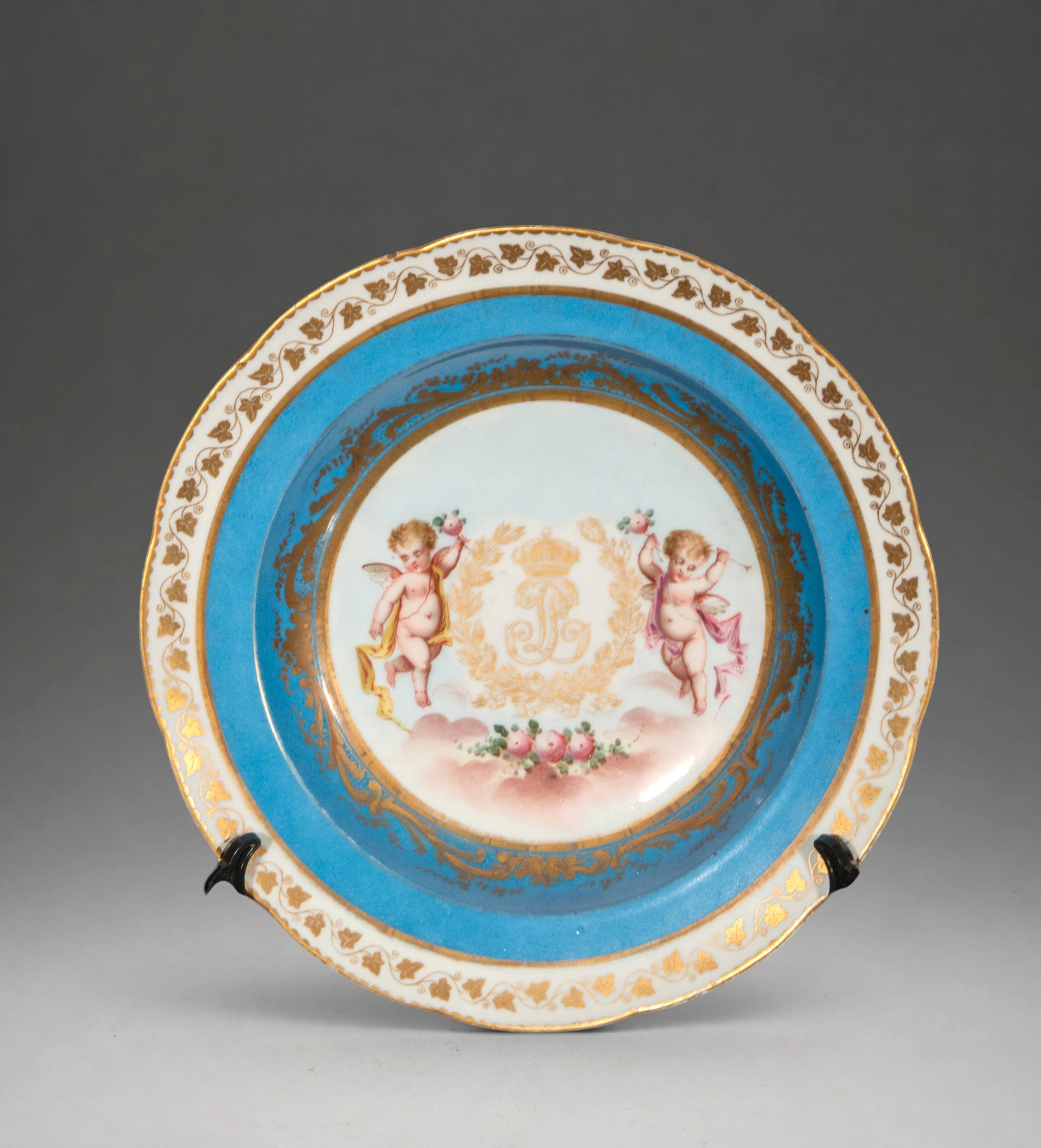 Plate with cherubs and floral decoration – French School, Sèvres style