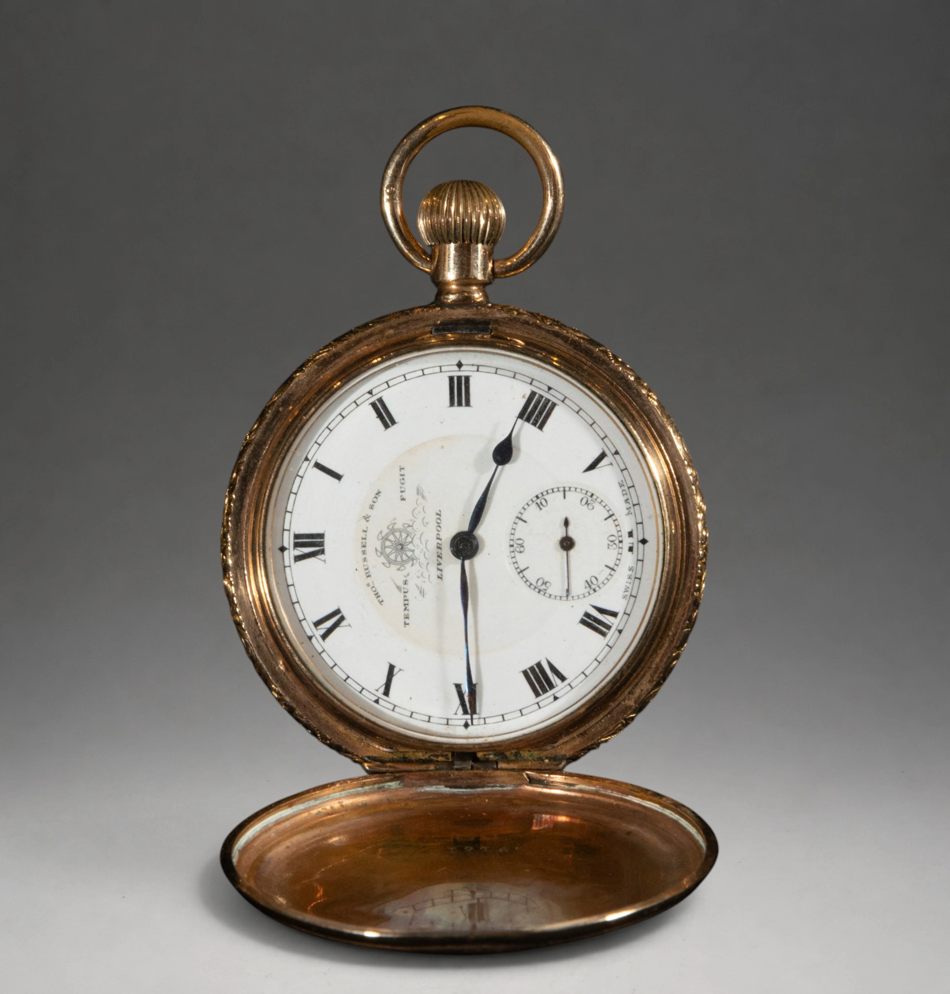 Pocket watch with hinged cover and Arabic numerals
