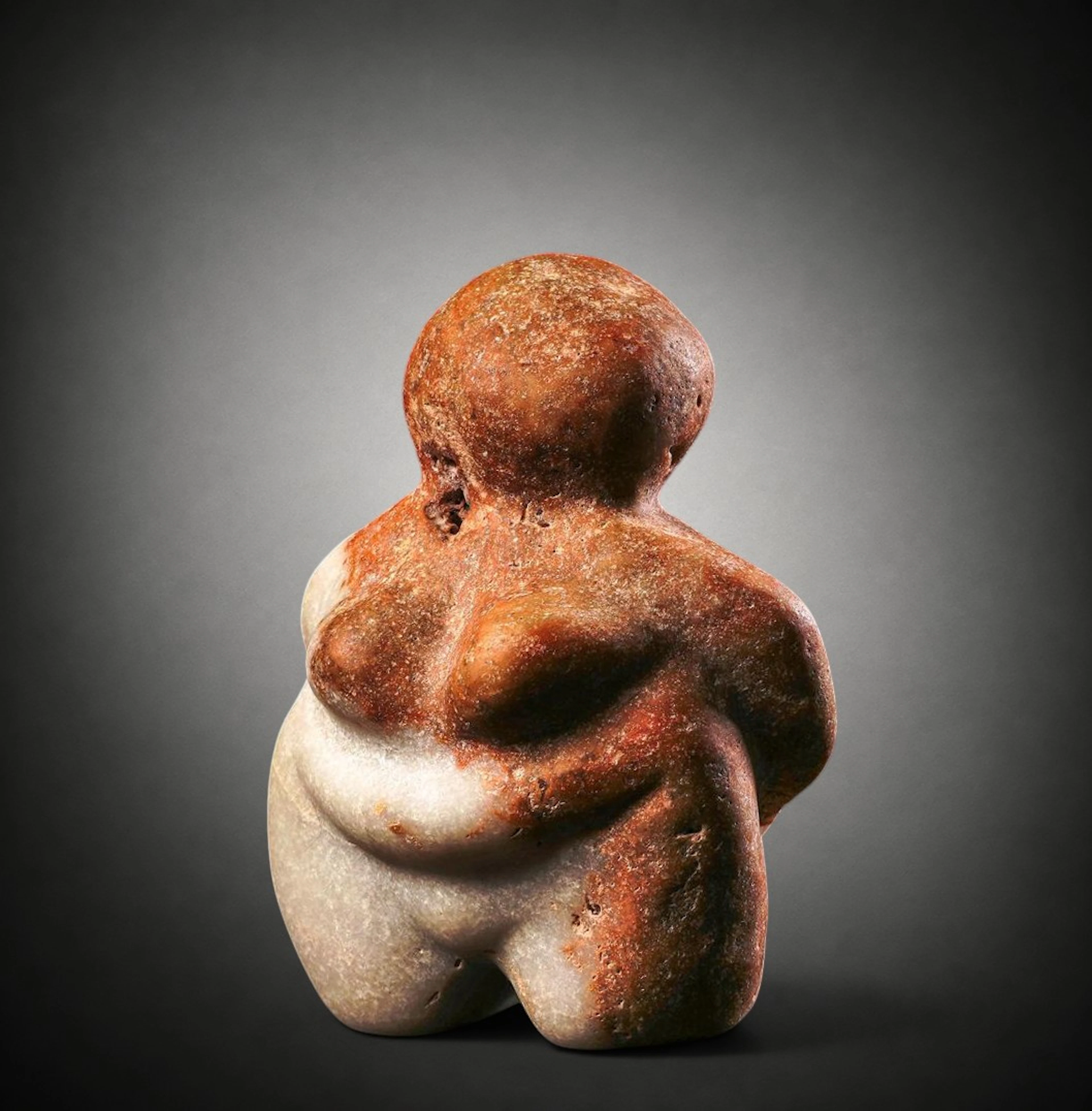 Neolithic steatopygous female figure in bicoloured marble, Mediterranean