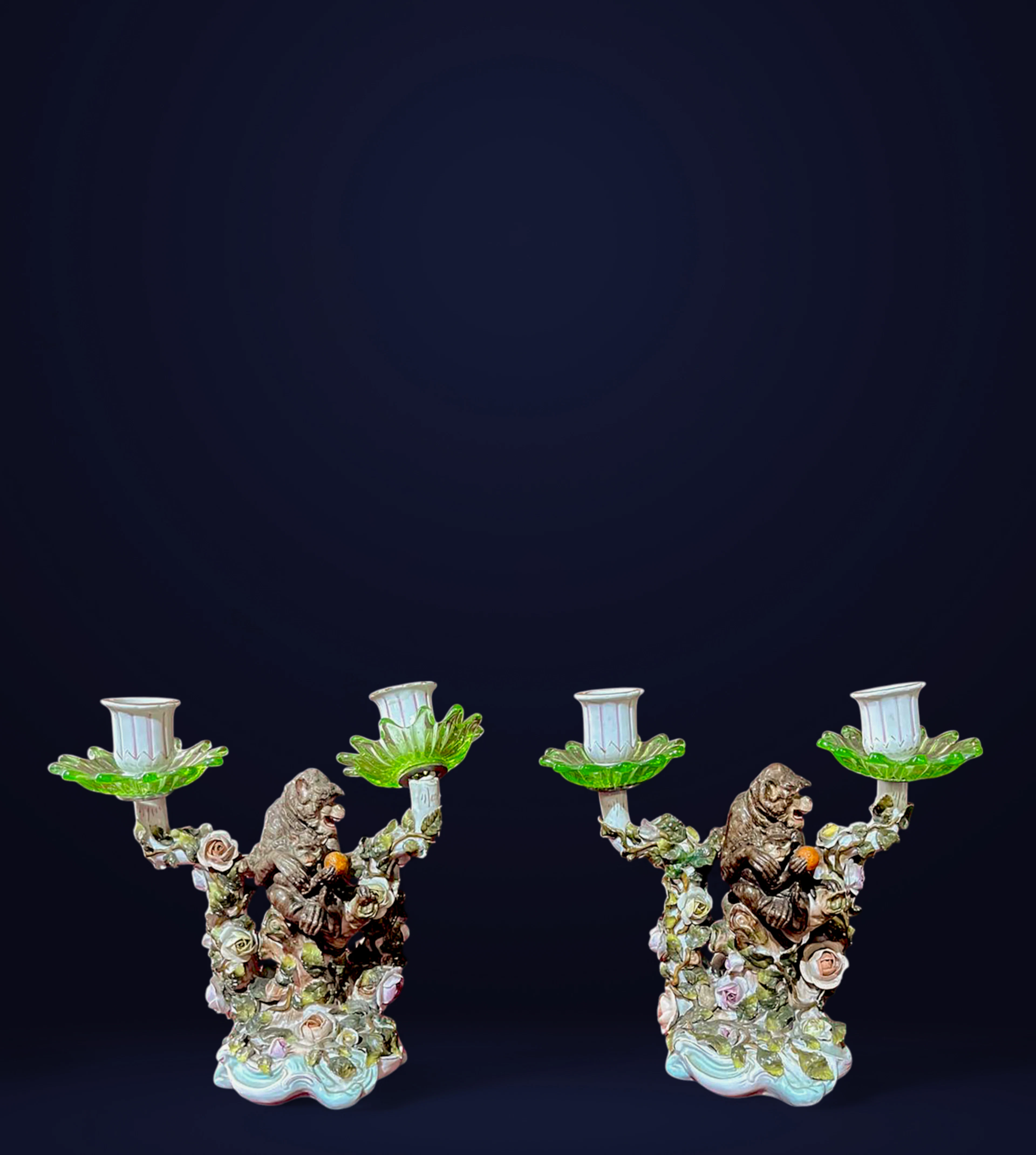 Pair of porcelain candlesticks with chimpanzees, Central Europe, 19th century
