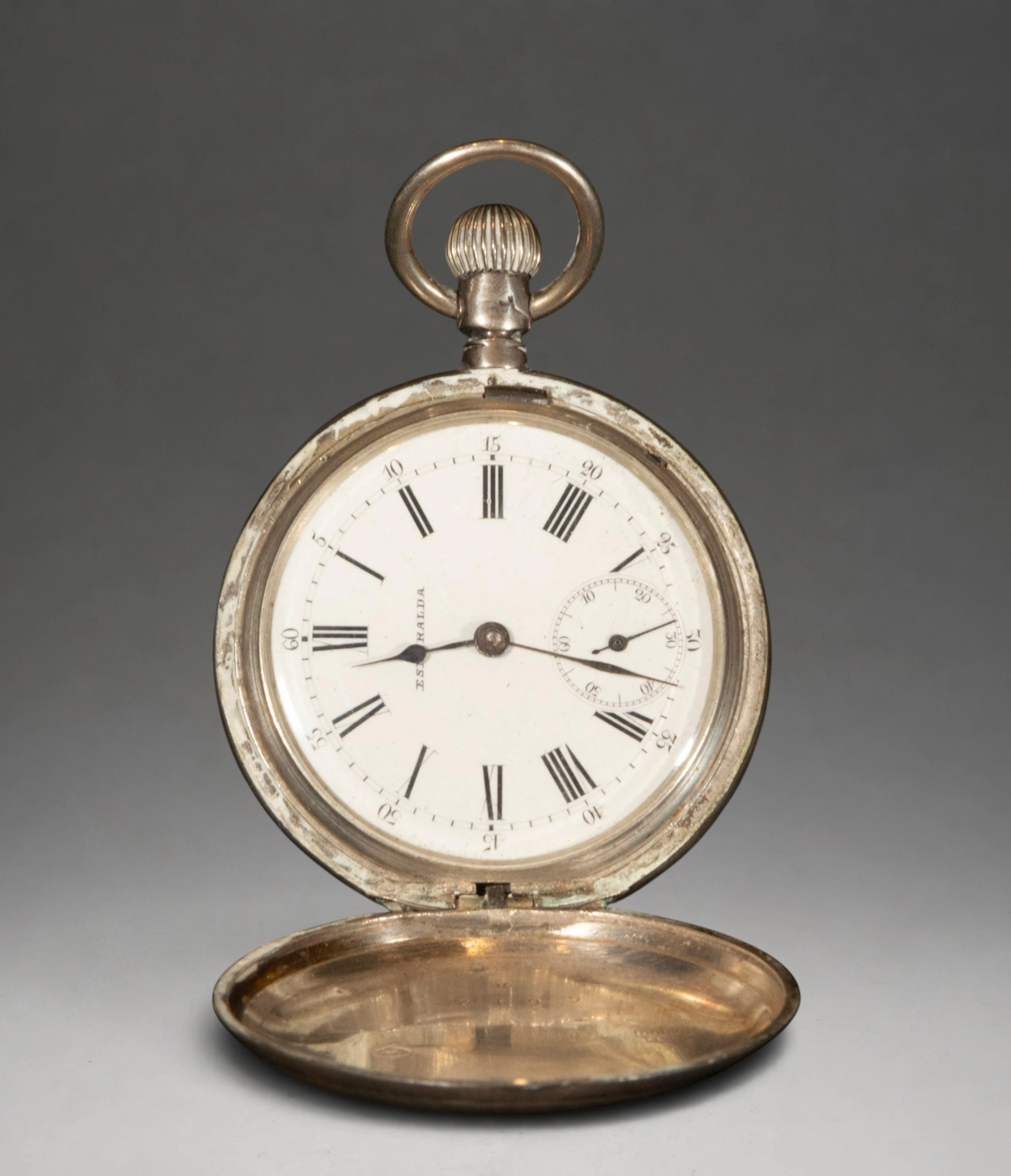 Gold pocket watch with Arabic numerals
