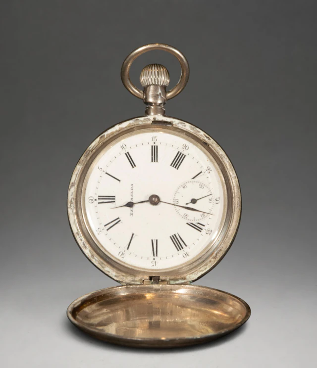 Gold pocket watch with Arabic numerals