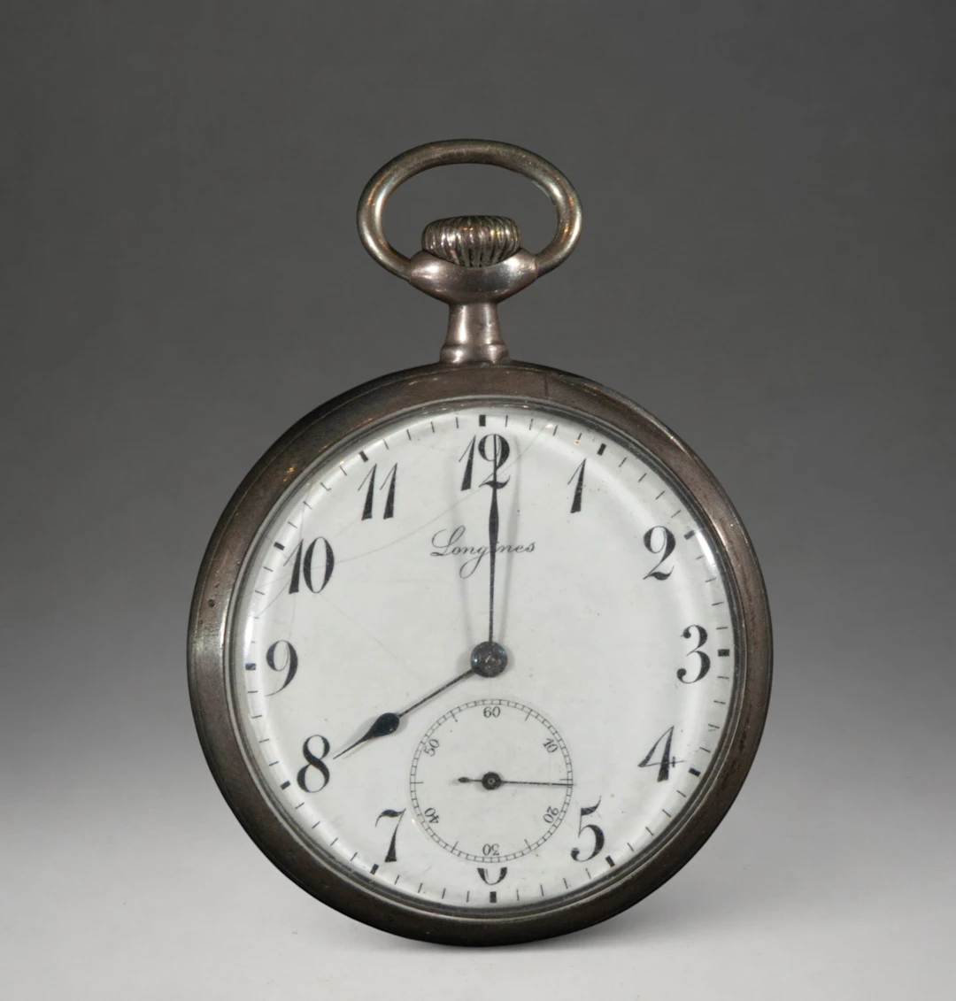 Pocket watch with Arabic numerals and second hand