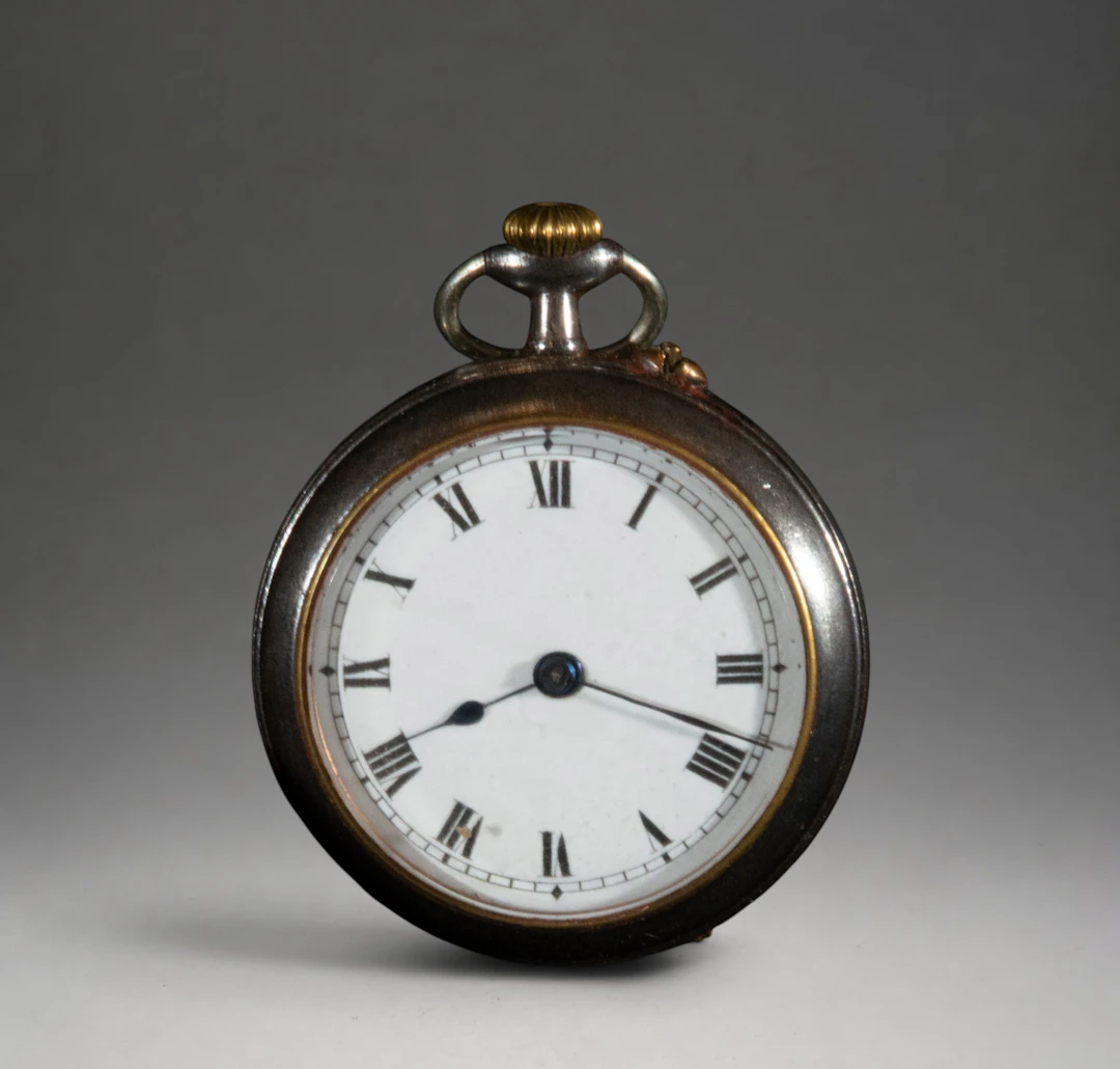 Small pocket watch with dark case
