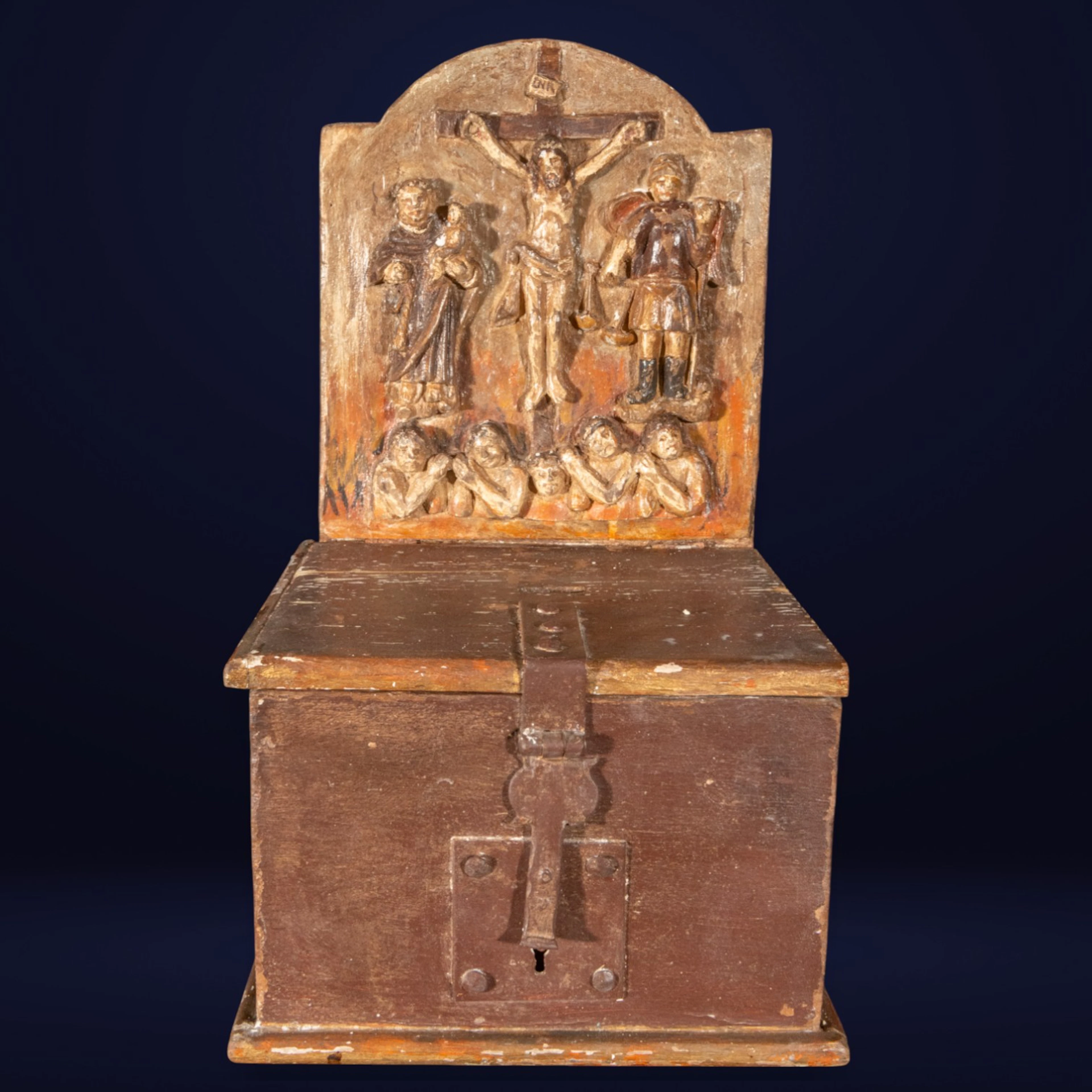 Alms chest with a relief of the crucifixion. 18th-century Colonial School