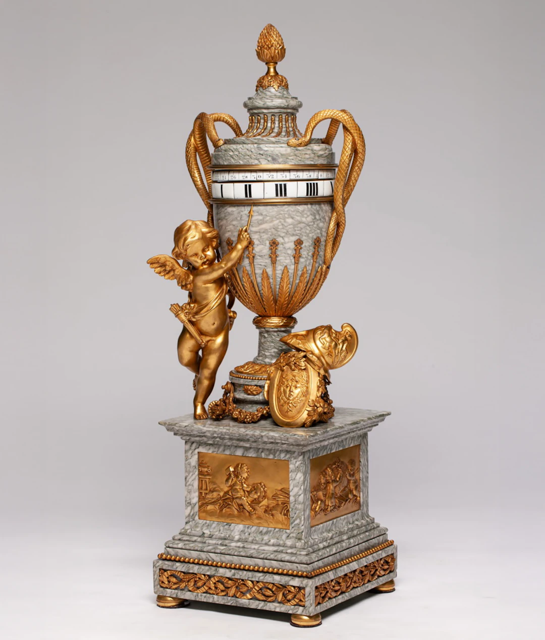 French vase clock in mercury-gilt bronze and veined white marble