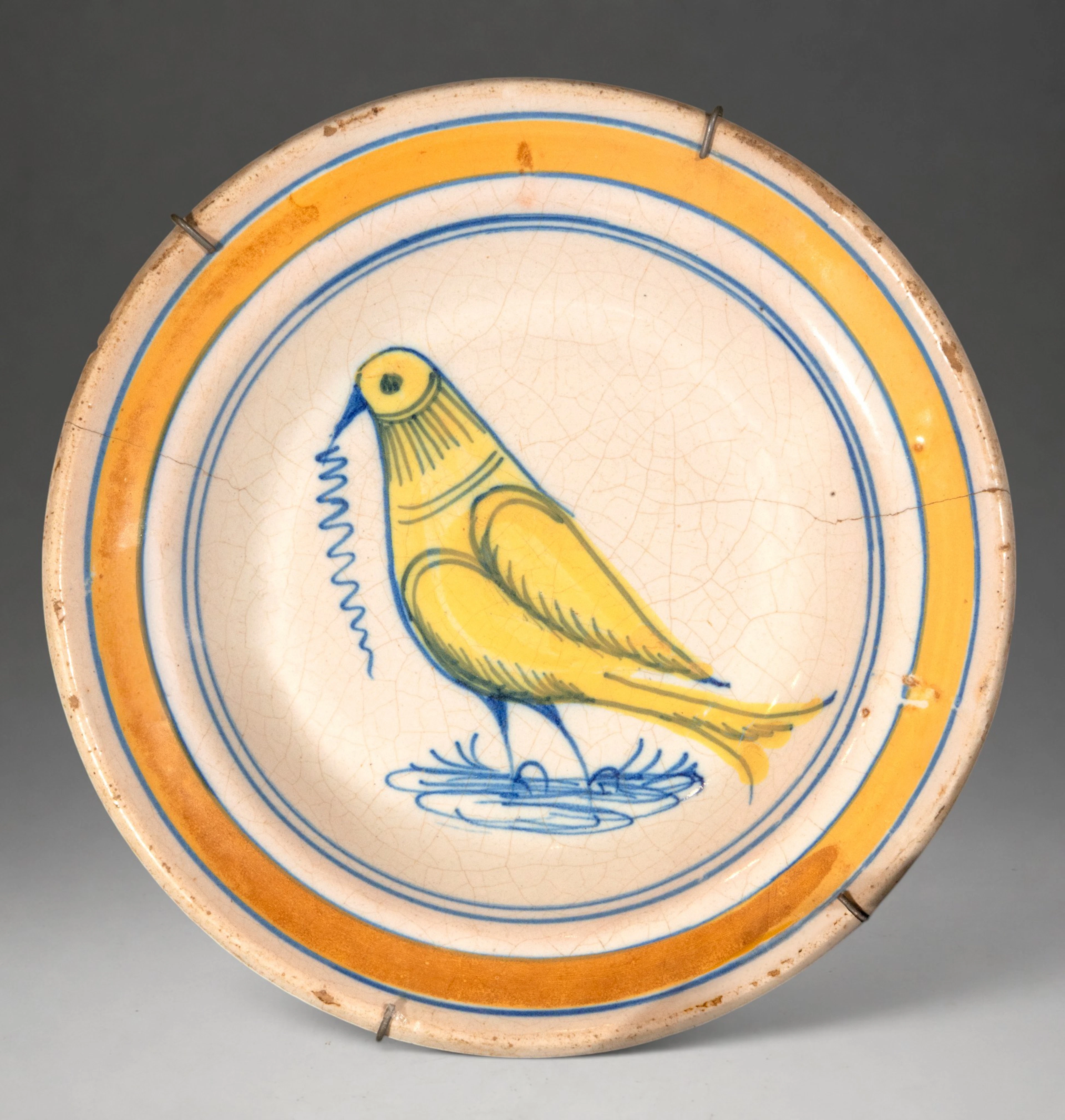 MANISES CERAMICS - Plate with yellow bird and polychrome decoration