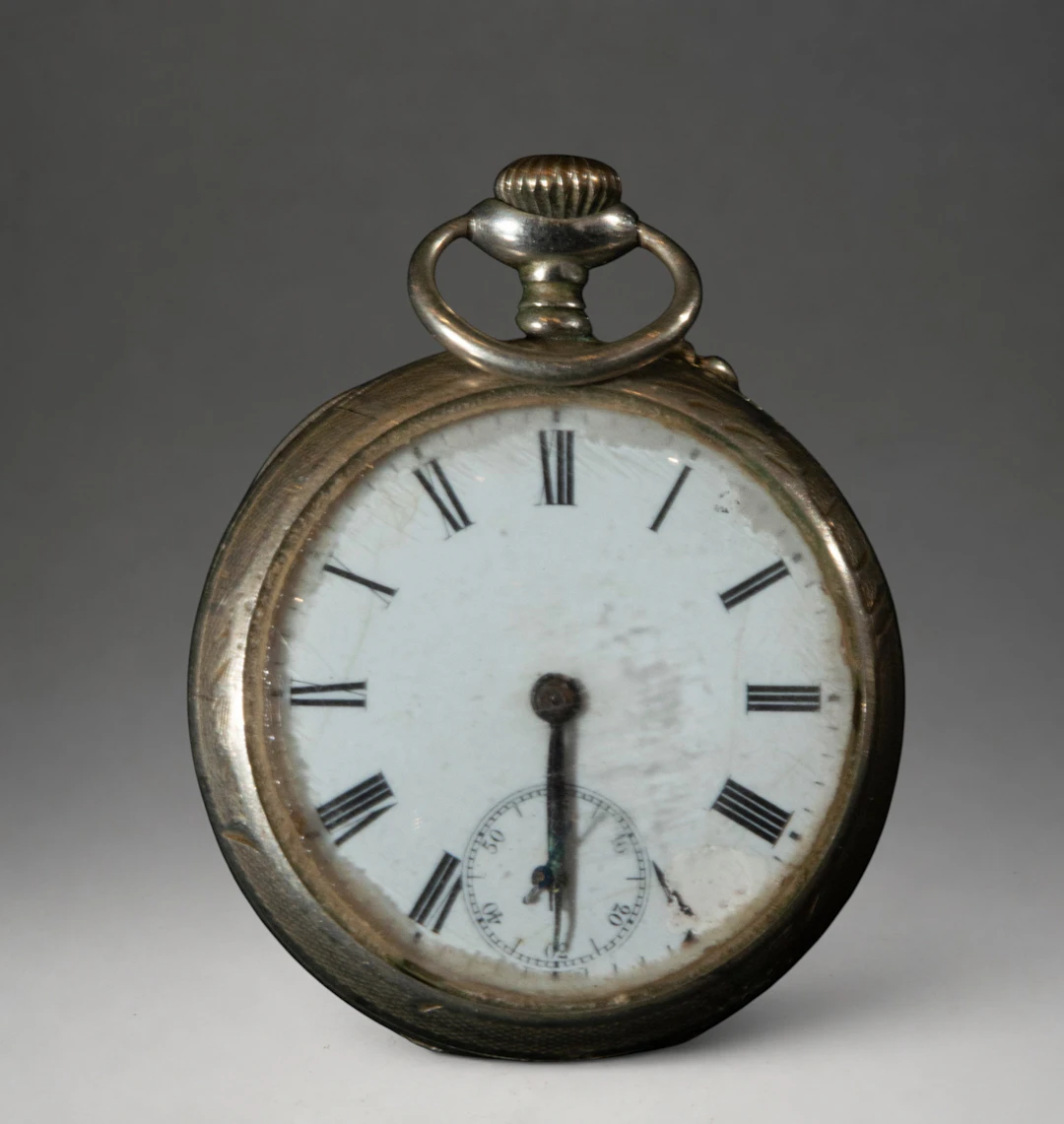 Pocket watch with white dial and Roman numerals