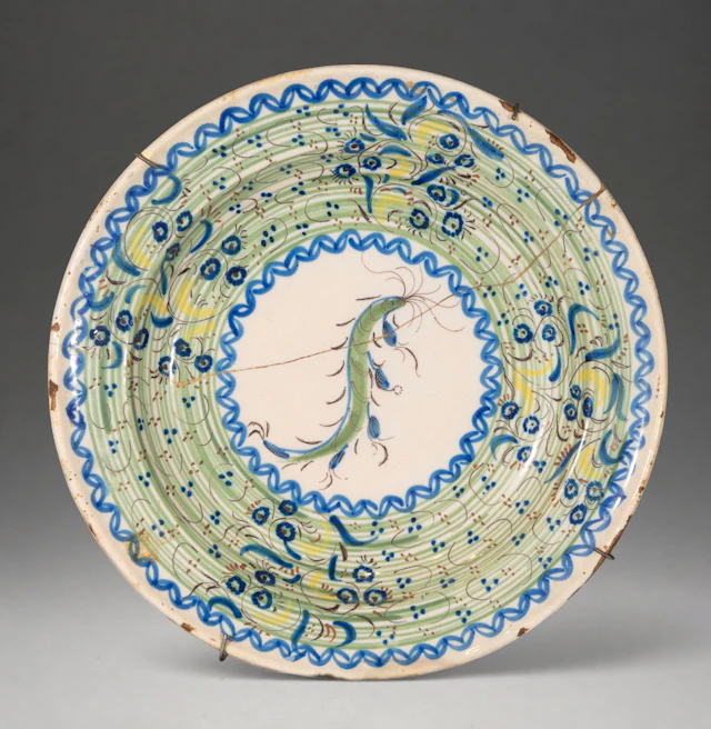 MANISES CERAMICS - Plate with polychrome plant decoration and central medallion