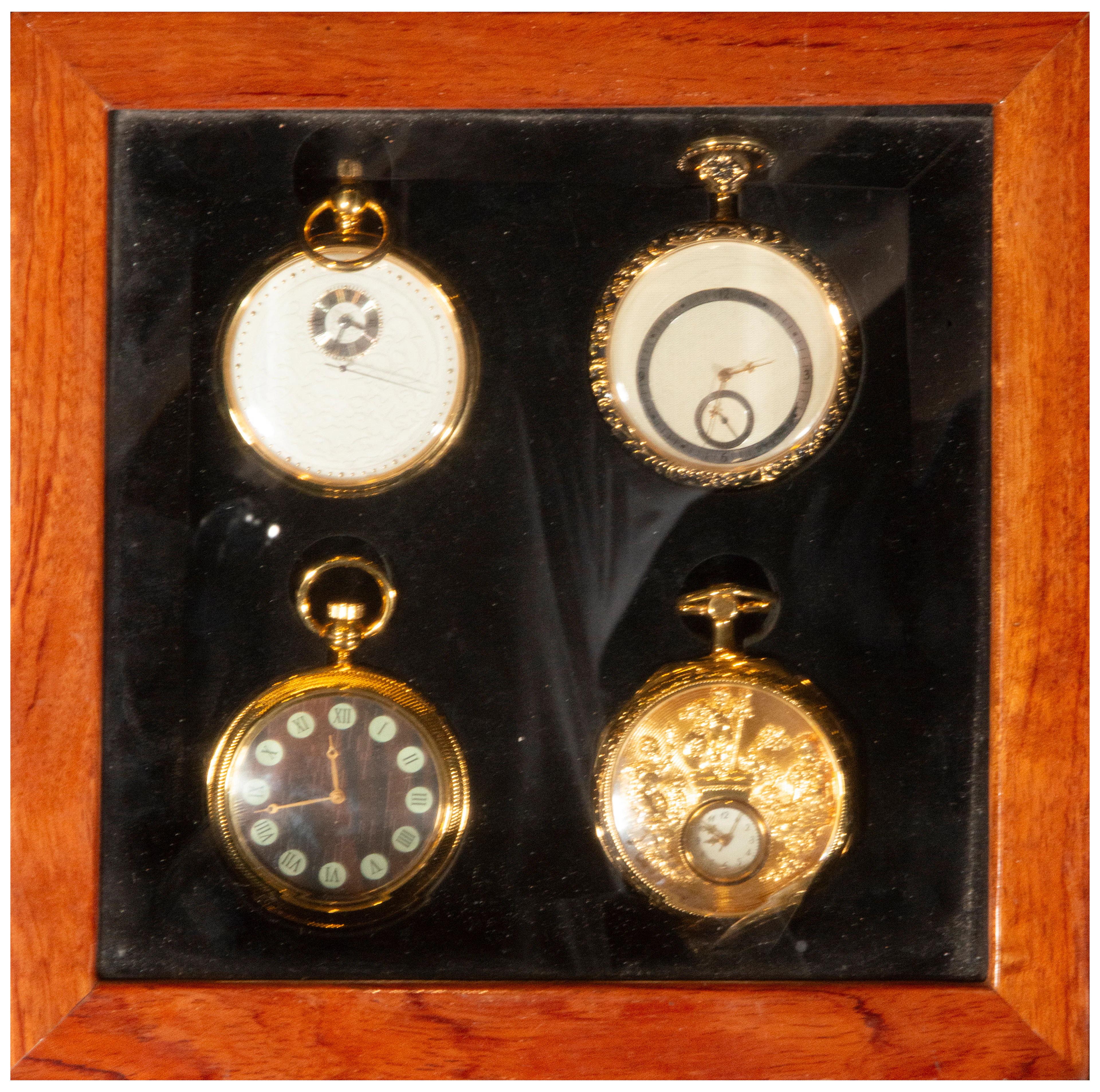 Set of four pocket watches with varied decoration