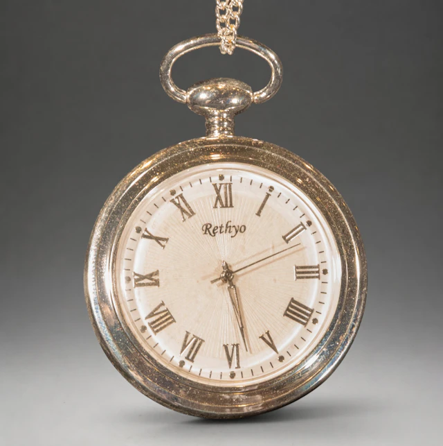 Rethyo pocket watch with Roman numerals and chain