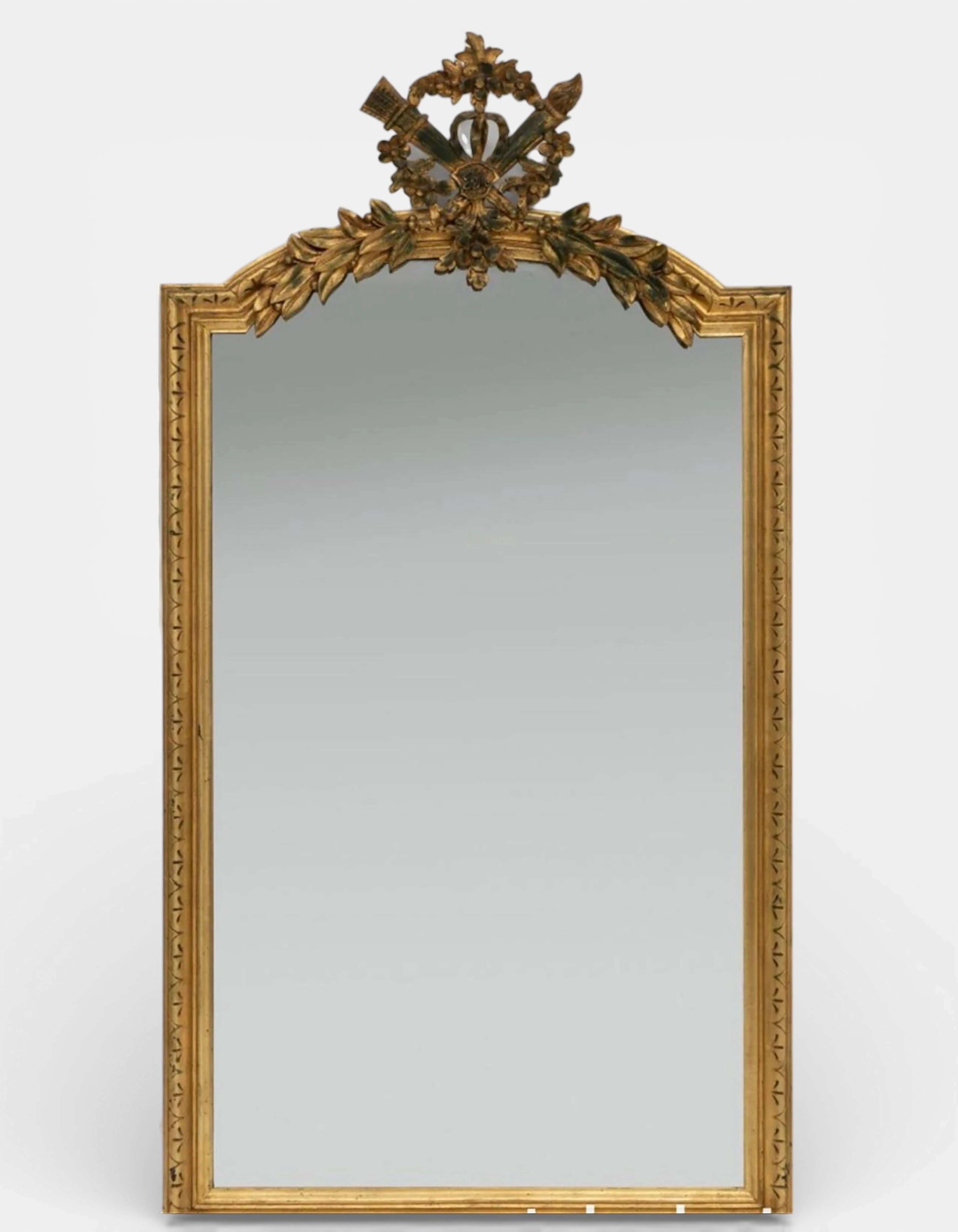Louis XVI style mirror; 19th century France. Carved and gilded wood.