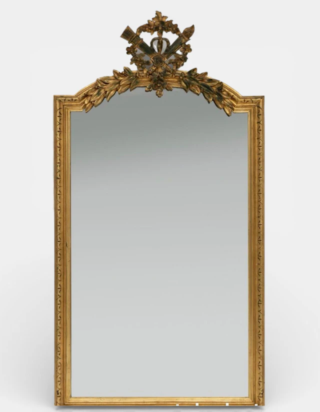 Louis XVI style mirror; 19th century France. Carved and gilded wood.