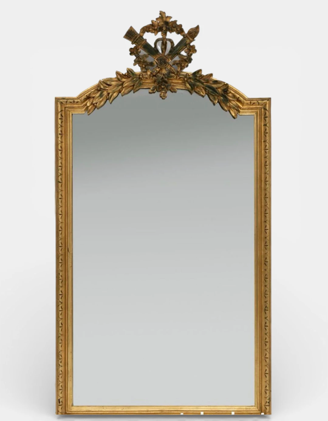Louis XVI style mirror; 19th century France. Carved and gilded wood.