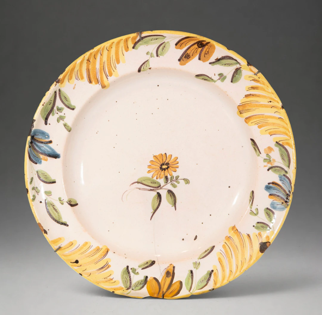 MANISES CERAMICS - Plate with polychrome floral decoration and ornamental rim