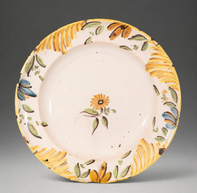 MANISES CERAMICS - Plate with polychrome floral decoration and ornamental rim