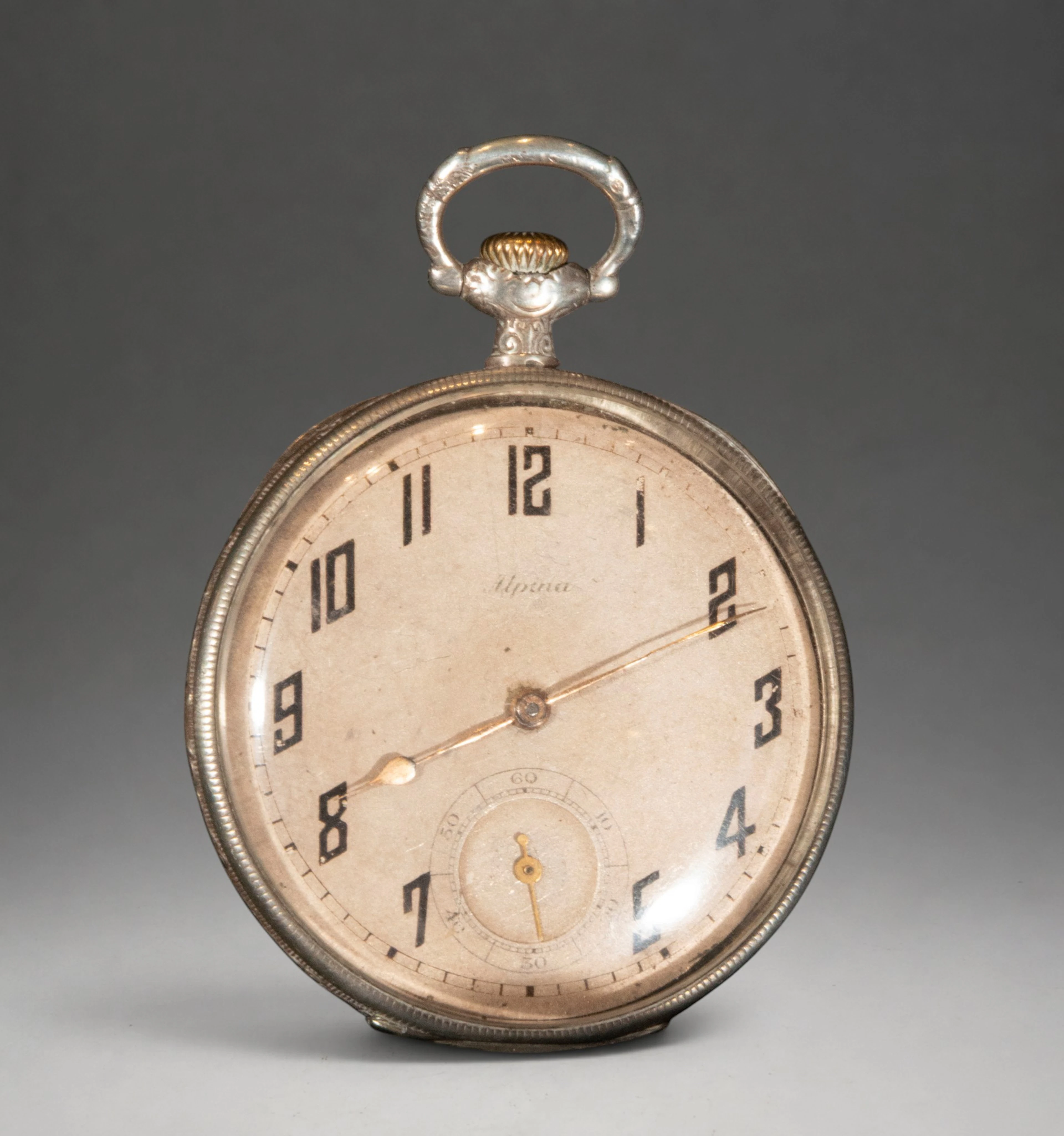 Pocket watch with stylized Arabic numerals