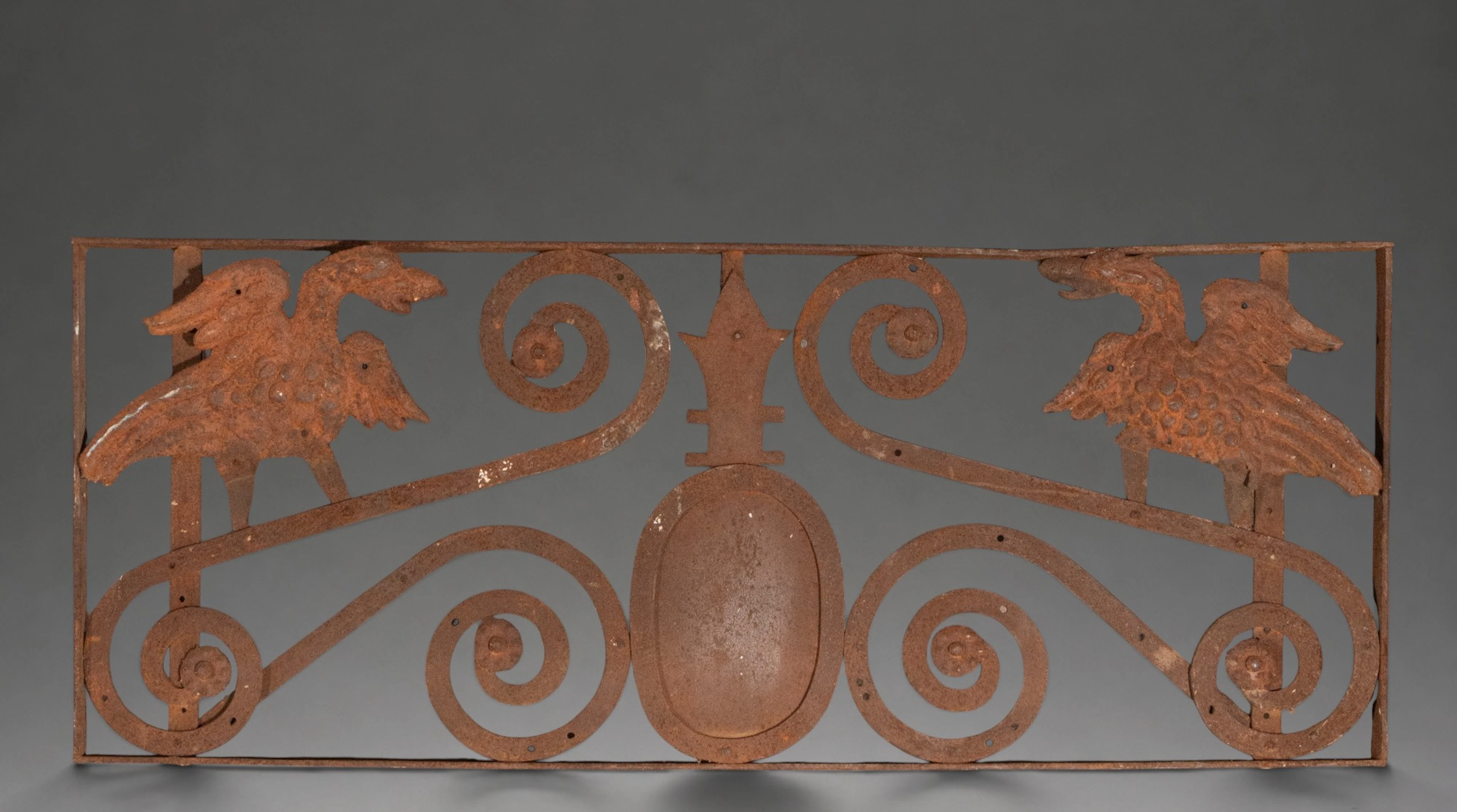 Wrought iron finial with facing birds and scrolls