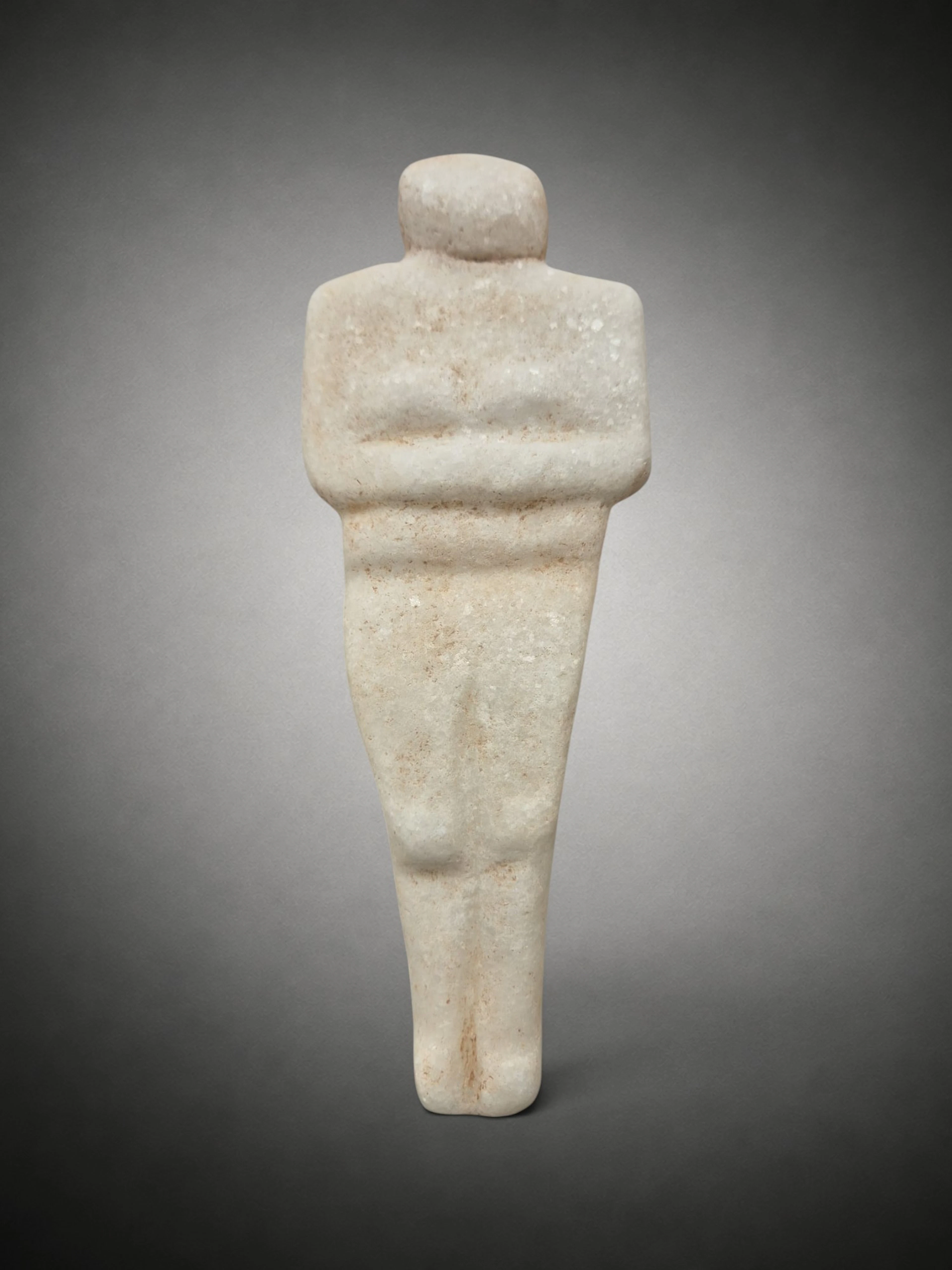 Neolithic steatopygous female figure in white marble, Eastern Europe
