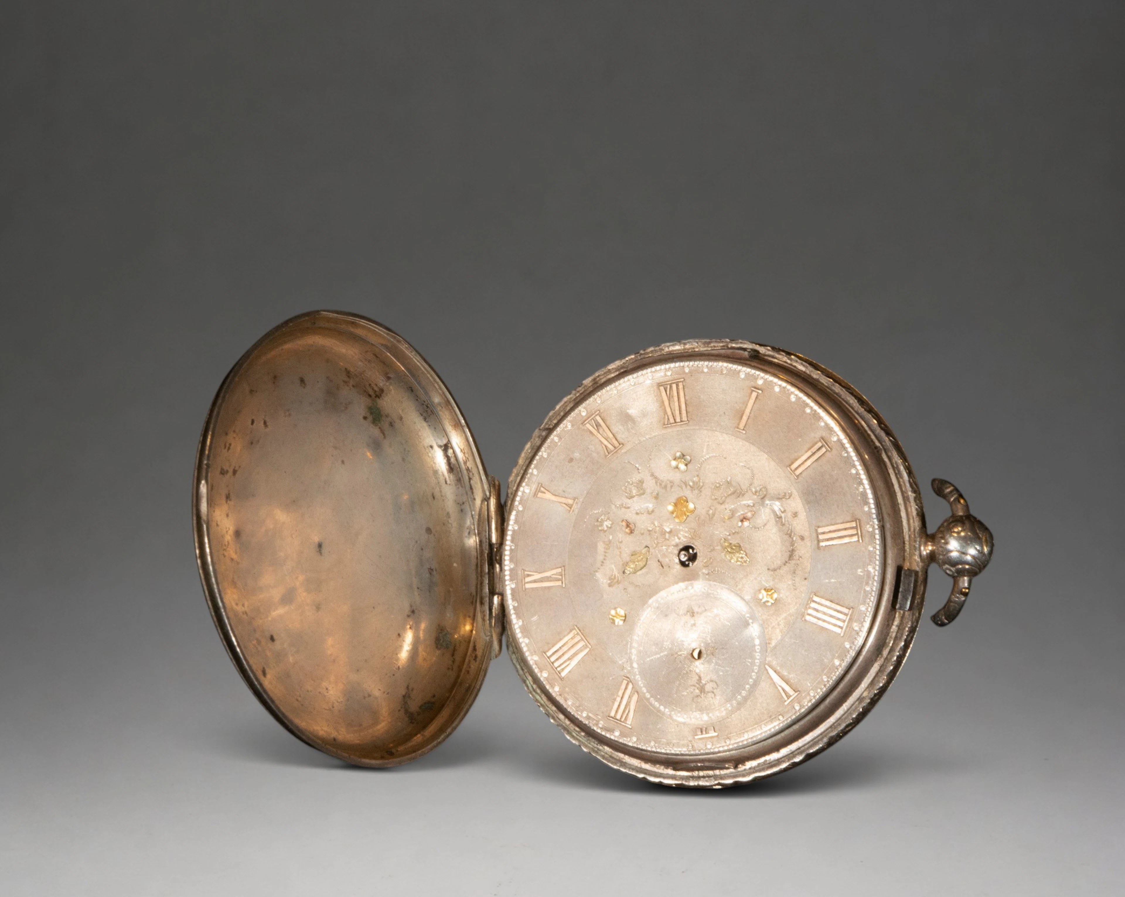 Pocket watch with gold case and Roman numerals