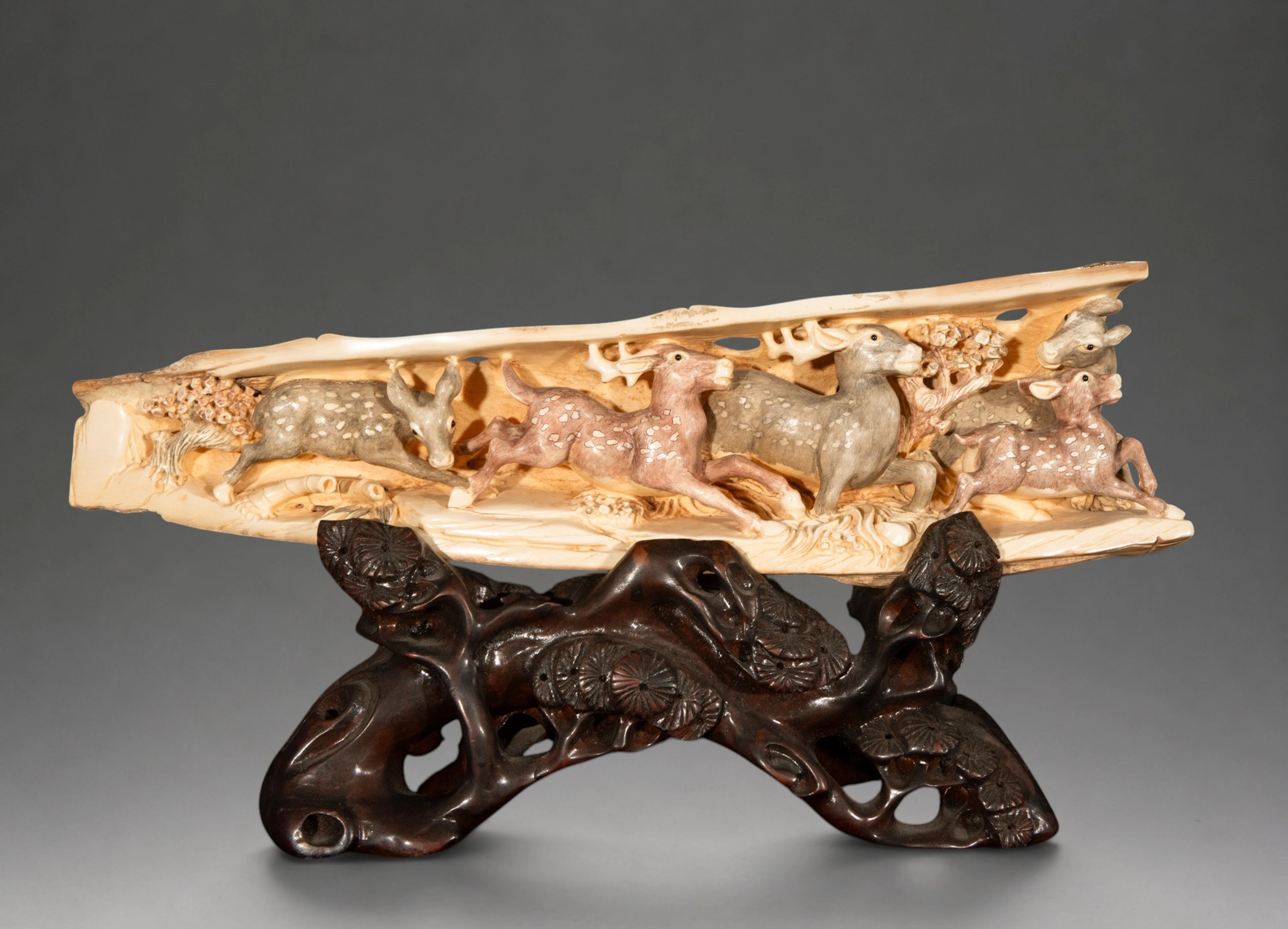 Mammoth tusk carved with deer, 20th century Chinese oriental school