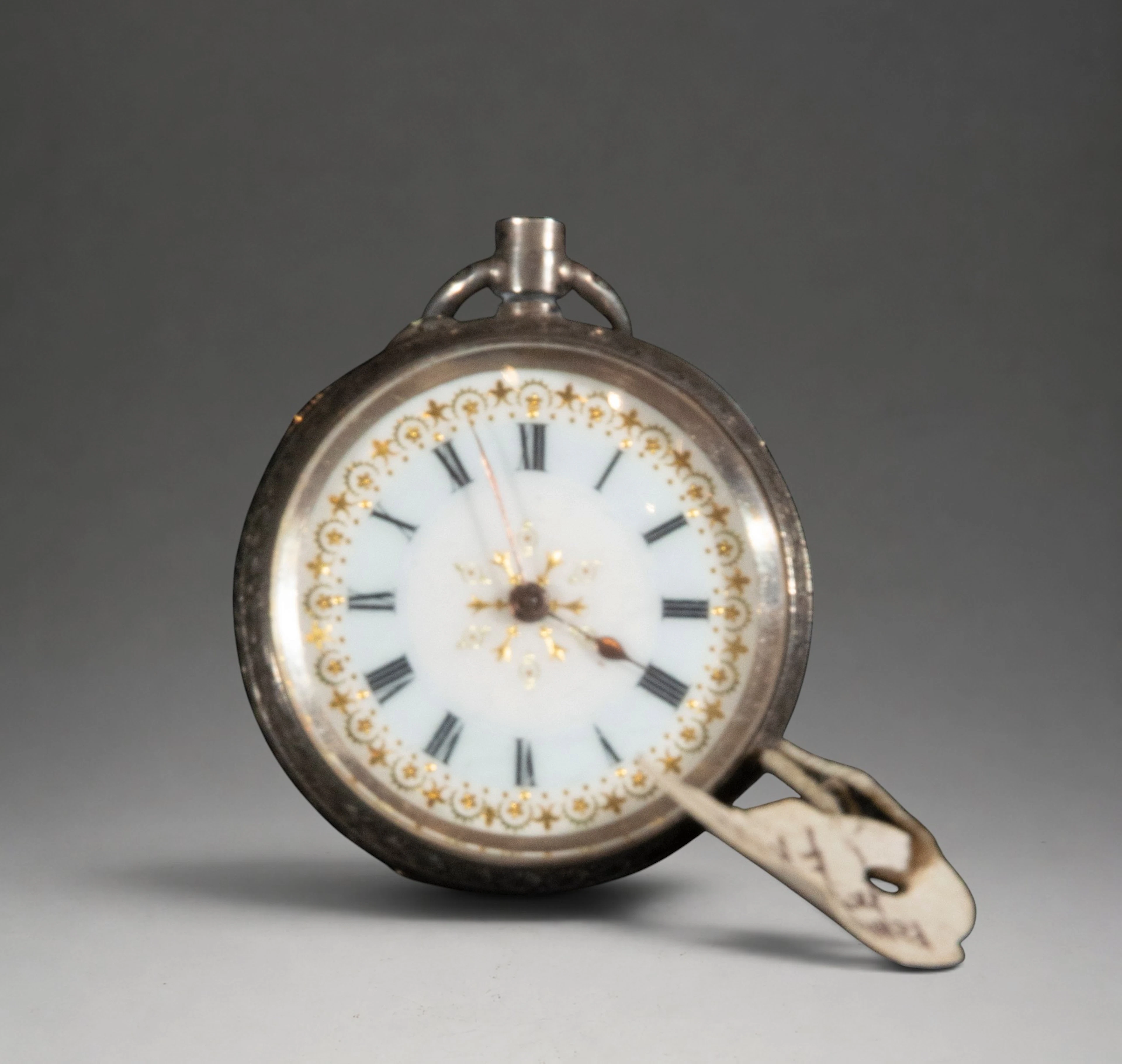 Small pocket watch with white dial