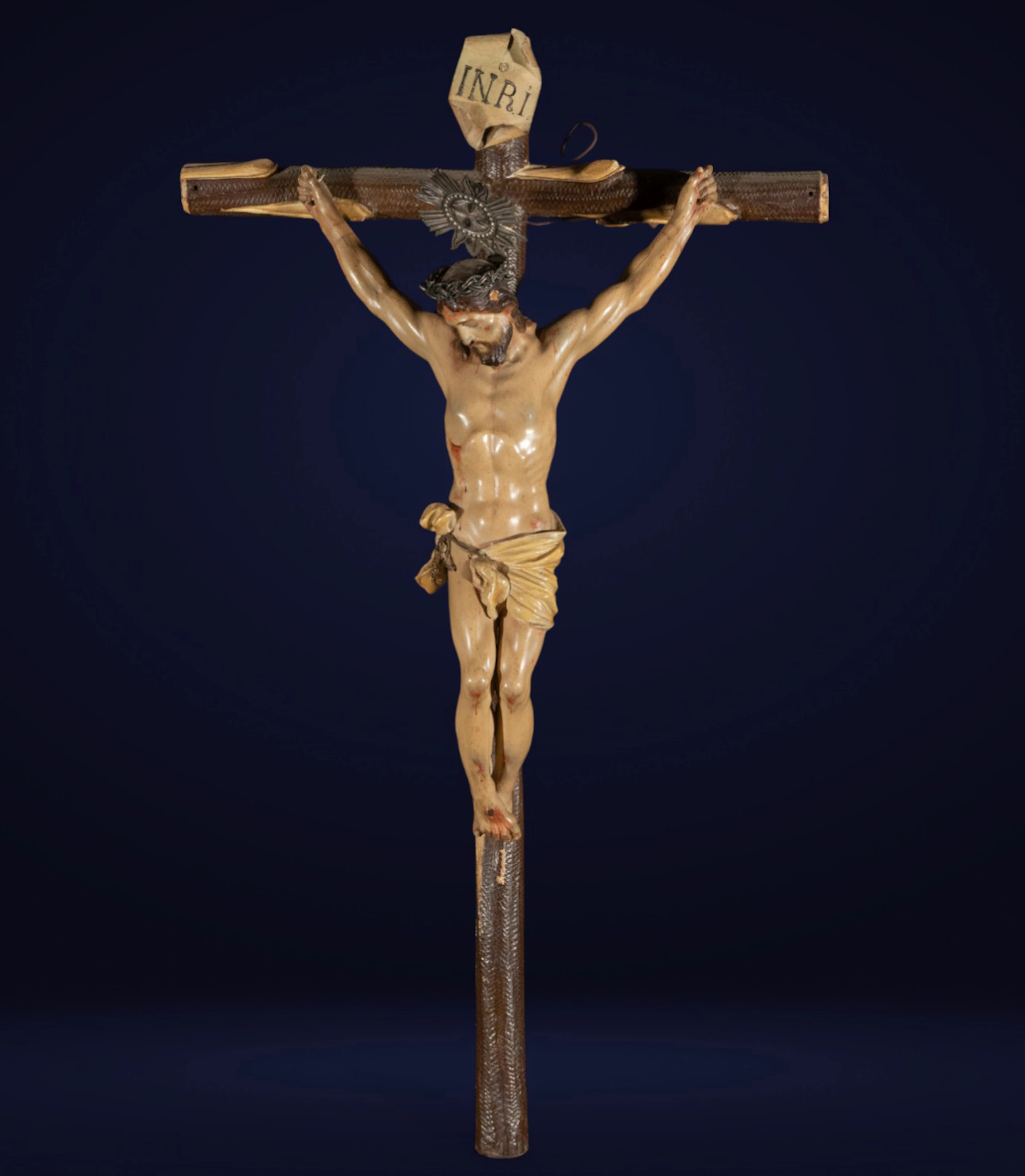 Carving structure of Christ crucified, Granada School, smiling