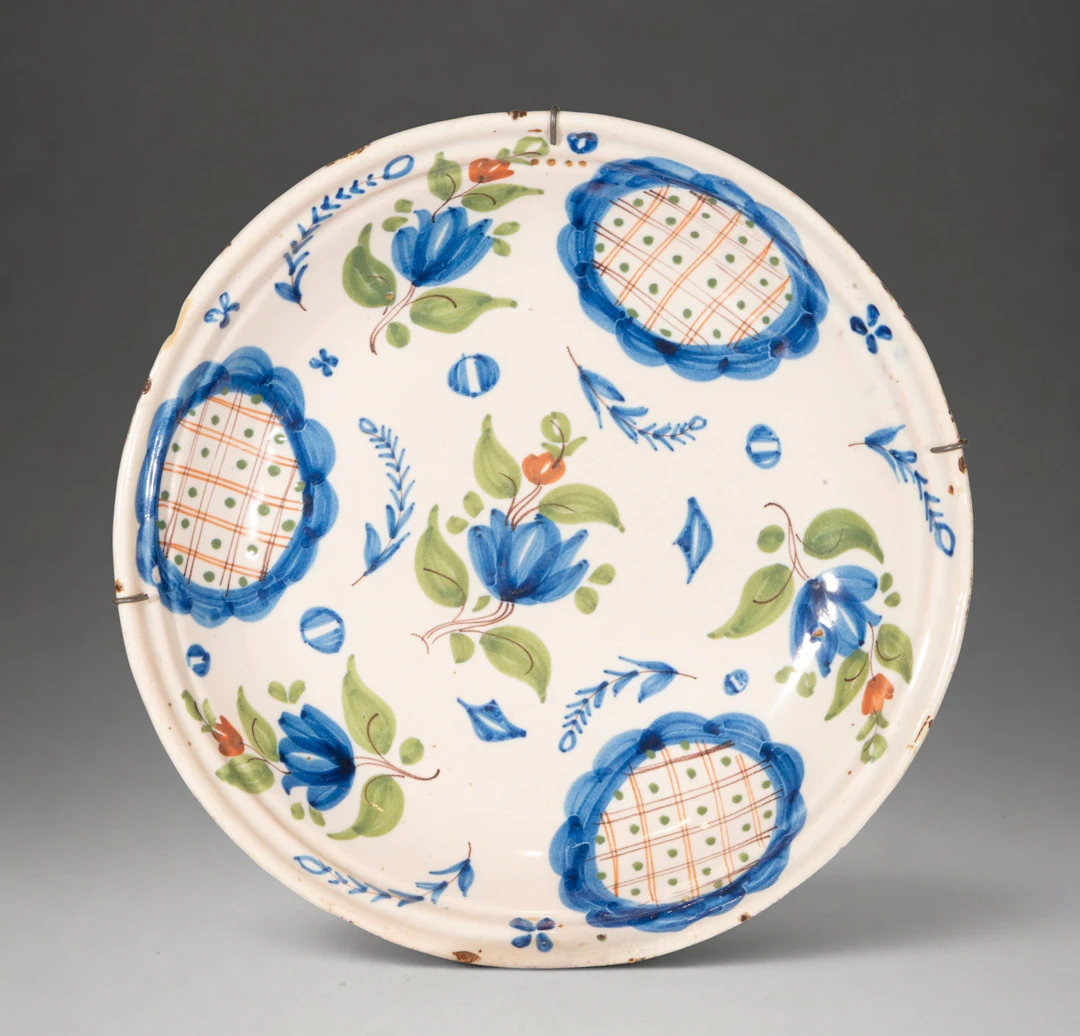 MANISES CERAMICS - Plate with polychrome floral decoration and reticulated