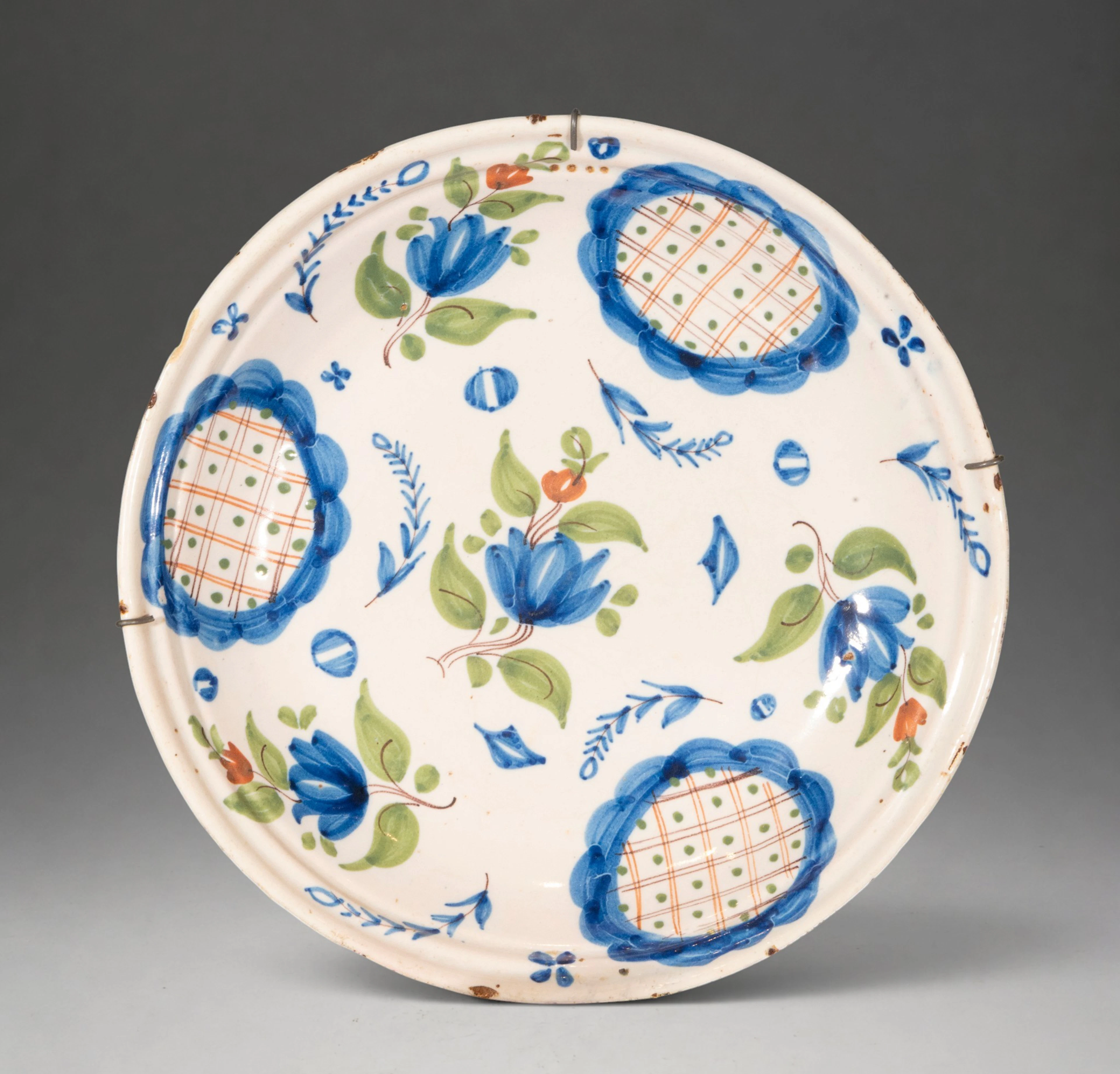 MANISES CERAMICS - Plate with polychrome floral decoration and reticulated