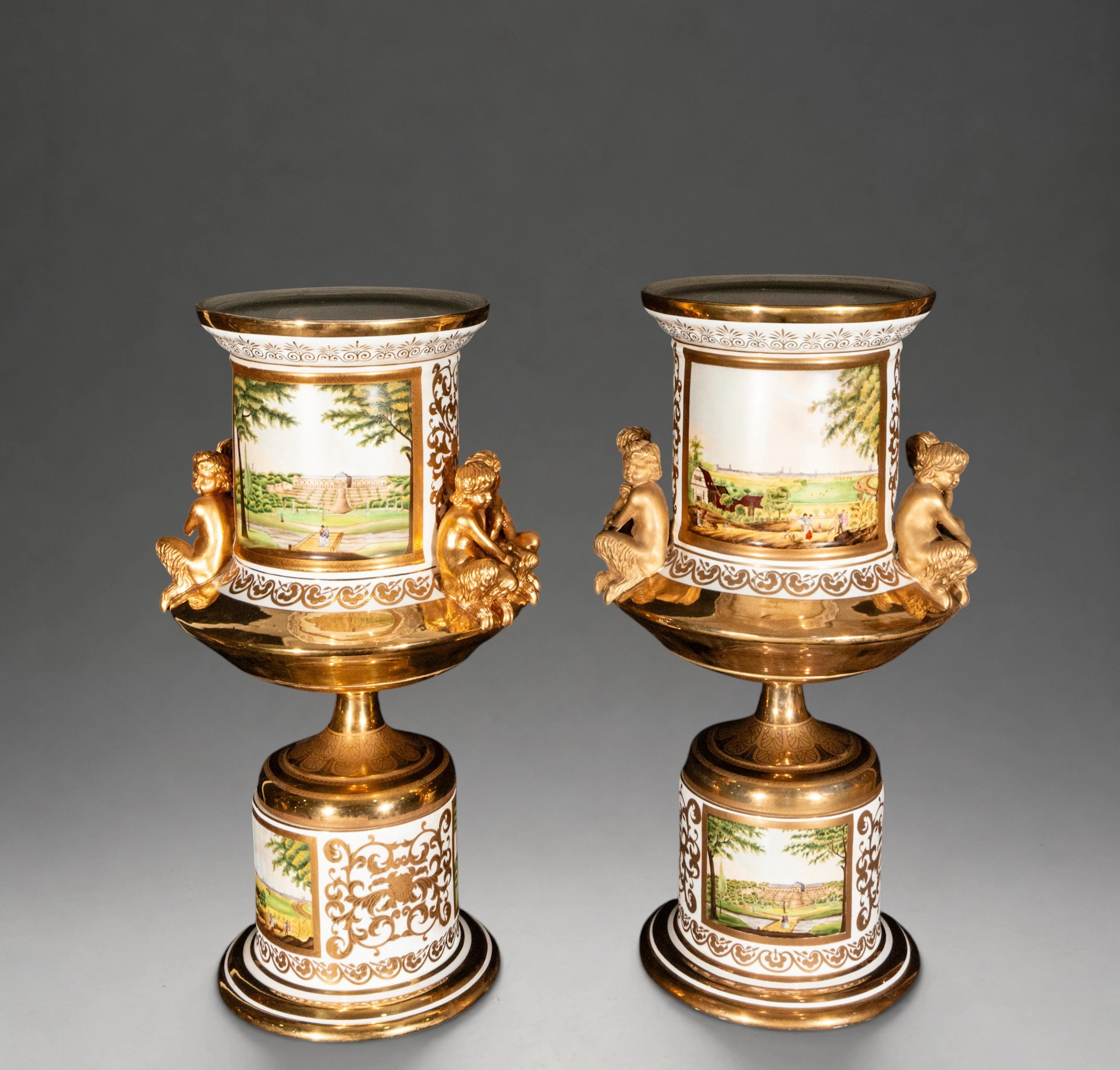 Pair of vases with palace views and gilded figures, marked KPM – Germany
