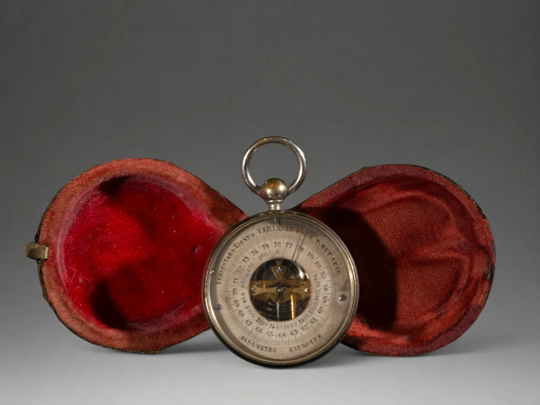 Pocket watch in red case