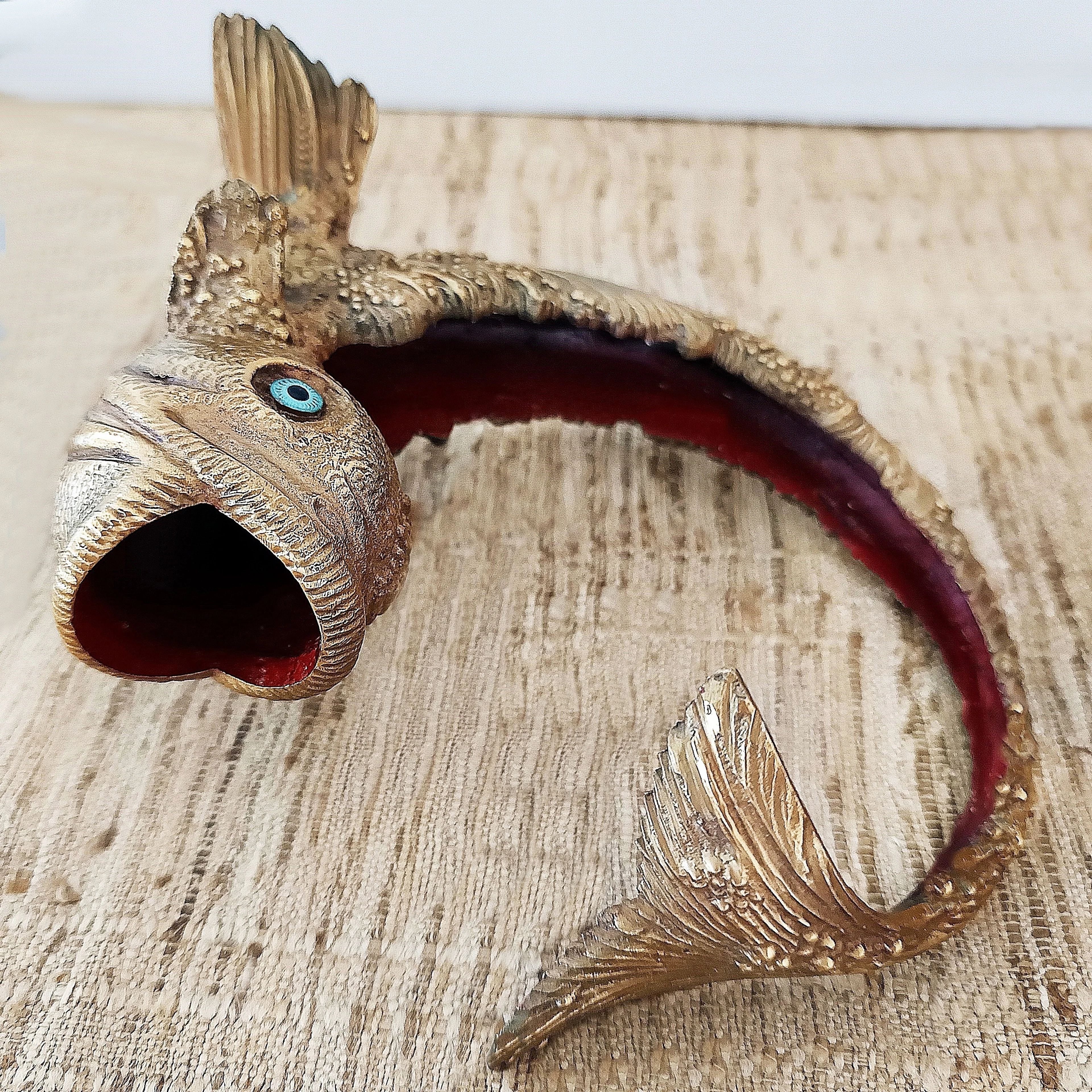 Gilded bronze fish figurine with red lacquered interior