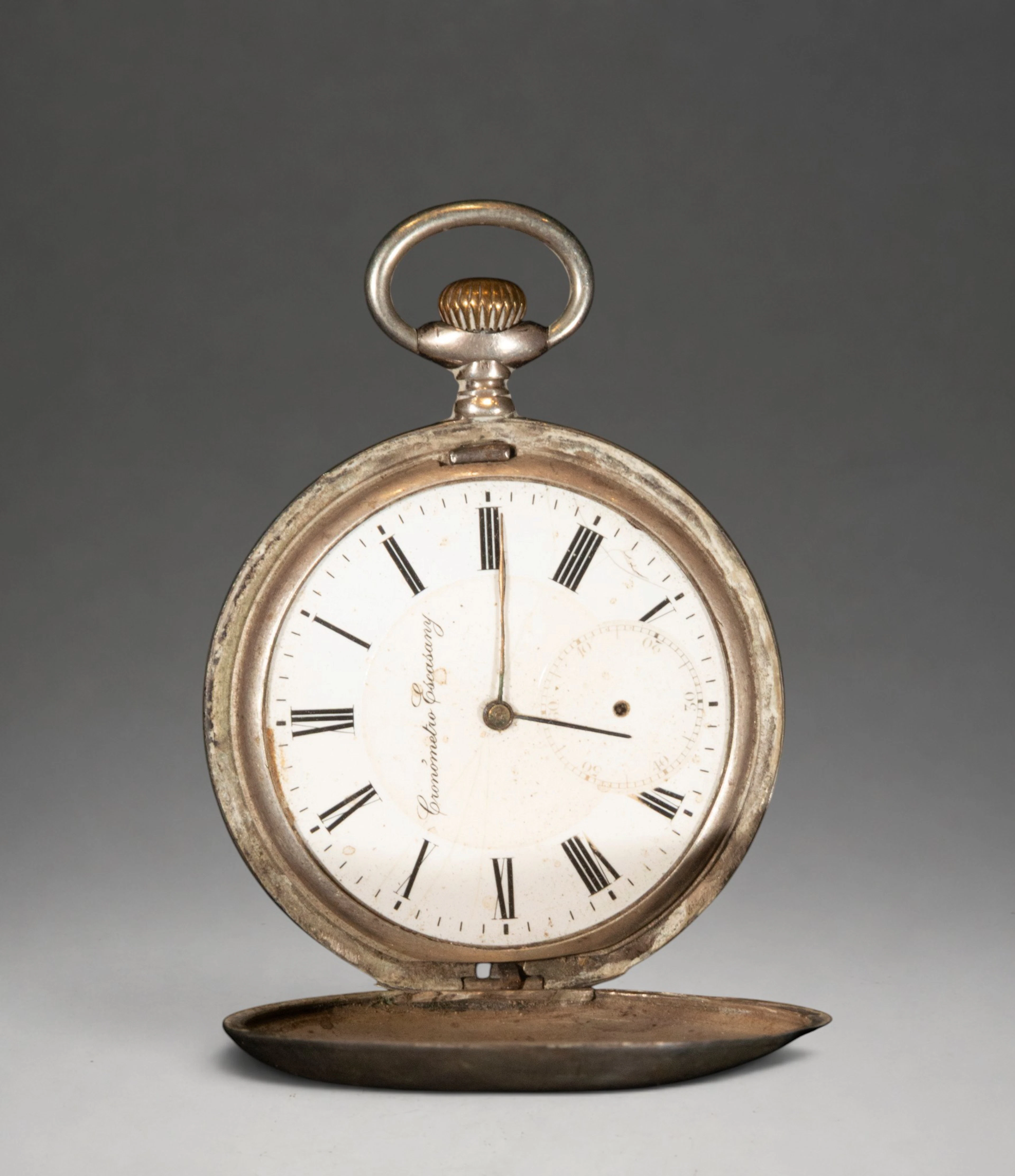 Pocket watch with white dial and Roman numerals