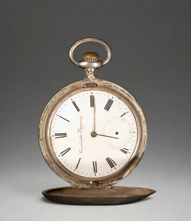 Pocket watch with white dial and Roman numerals
